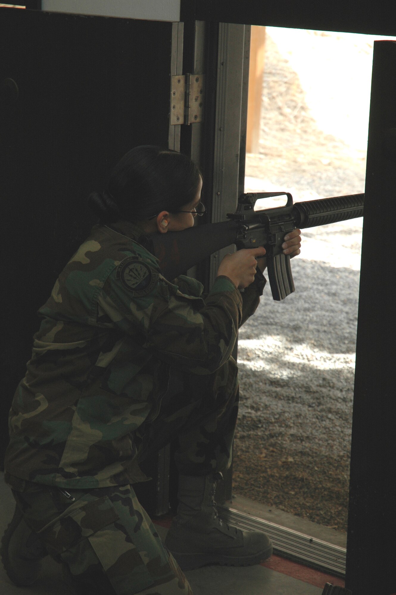 Airman 1st Class Liseth Rodriguez, 341st Security Forces Group Tactical Response Force, fires in the kneeling position at an Excellence in Competition match held here March 17 to 22. (U.S. Air Force photo/Airman 1st Class Emerald Ralston)