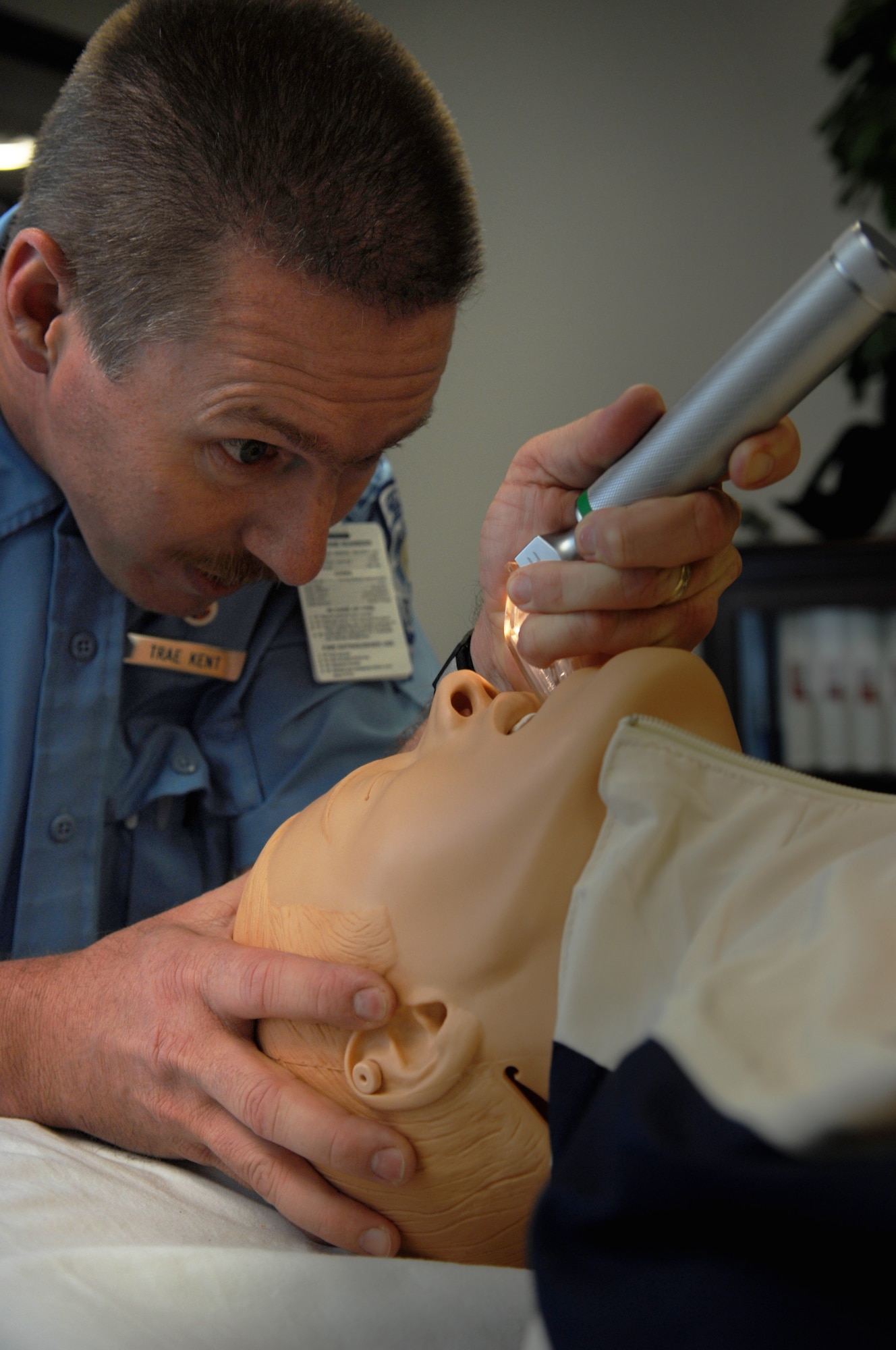 MOODY AIR FORCE BASE, Ga. – Leland Kent, 23rd Medical Group paramedic, performs an oral intubation on an Advance Life Support simulator here March 26.  Oral intubation is a procedure that is done to open the airways of a patient and to keep them breathing. (U.S. Air Force photo by Senior Airman Angelita Lawrence)