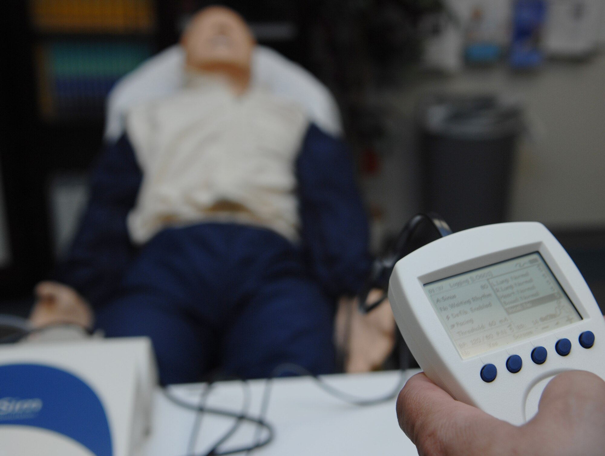 MOODY AIR FORCE BASE, Ga. – Mark Soliz, 23rd Medical Group education training manager, controls the vitals of an Advance Life Support simulator with a hand held remote here March 26.  The ALS simulators are new life-like technology that Moody received to enhance medical team training. (U.S. Air Force photo by Senior Airman Angelita Lawrence)