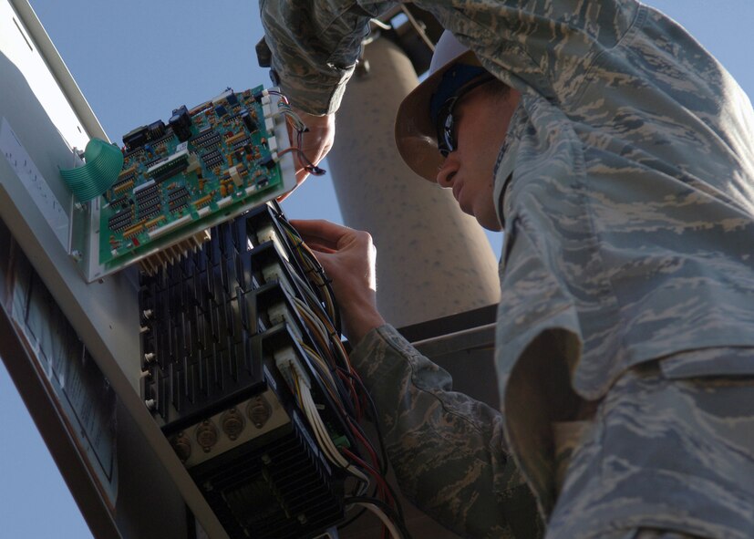DYESS AIR FORCE BASE, Texas -- Senior Airman Brandon Allen tests the amplifiers on the base's emergency alert system, March 25. The emergency alert system uses amplifiers to help carry the transmissions that it sends further. (U.S. Air Force Photo by Airman 1st Class Micheal Breaux)