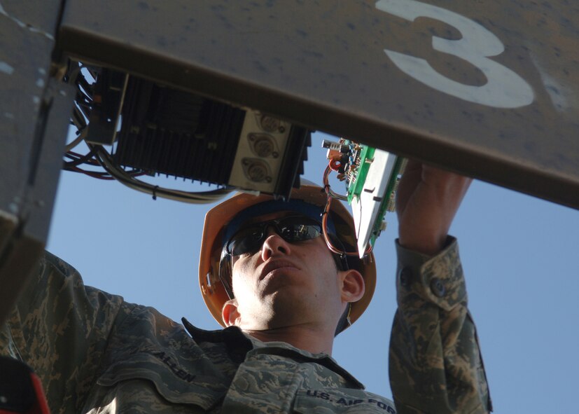 DYESS AIR FORCE BASE, Texas -- Senior Airman Brandon Allen changes the fuses on the base's emergency alert system, March 25. The emergency alert system is the same system that plays the national anthem at 5 p.m. to signal the end of the duty day. (U.S. Air Force Photo by Airman 1st Class Micheal Breaux)