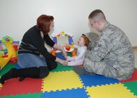 MINOT AIR FORCE BASE, N.D. -- Mrs. Tara Lynn Doss, winner of the Mrs. Minot pageant, and husband Airman 1st Class Daniel Doss play with daughter Olivia Rose celebrating Mrs. Doss’ win of the title Mrs. Minot. Mrs. Doss will be competing for the title of Mrs. North Dakota in Fargo on April 25th; if she wins she will be given the opportunity to compete for Mrs. United States in September. (U.S. Air Force photo by Senior Airman Cassandra Jones)