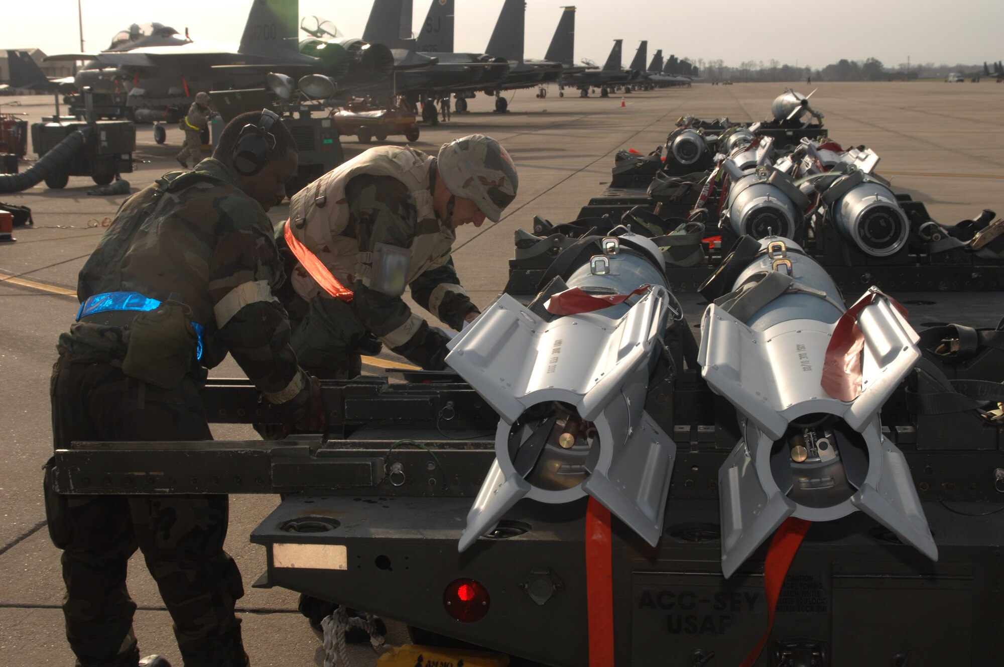 SEYMOUR JOHNSON AFB N.C. - Tech Sergeant Noal Yarnes, 4th Equipment Maintenance Squadron, works with Senior Airman Ryan Morgan, 336th Aircraft Maintenance Unit, to load of the plane with ammo during the Operational Readiness Exercise March 18, 2008 at Seymour Johnson AFB, N.C.  The exercise is To evaluate the 4 FW?s ability to survive and operate (ATSO), employ aircraft and resources, and conduct mission support activities in a steady state combat environment, and to provide training opportunities to improve on existing capabilities.  (U.S. Air Force photo by Senior Airman Chad Trujillo)