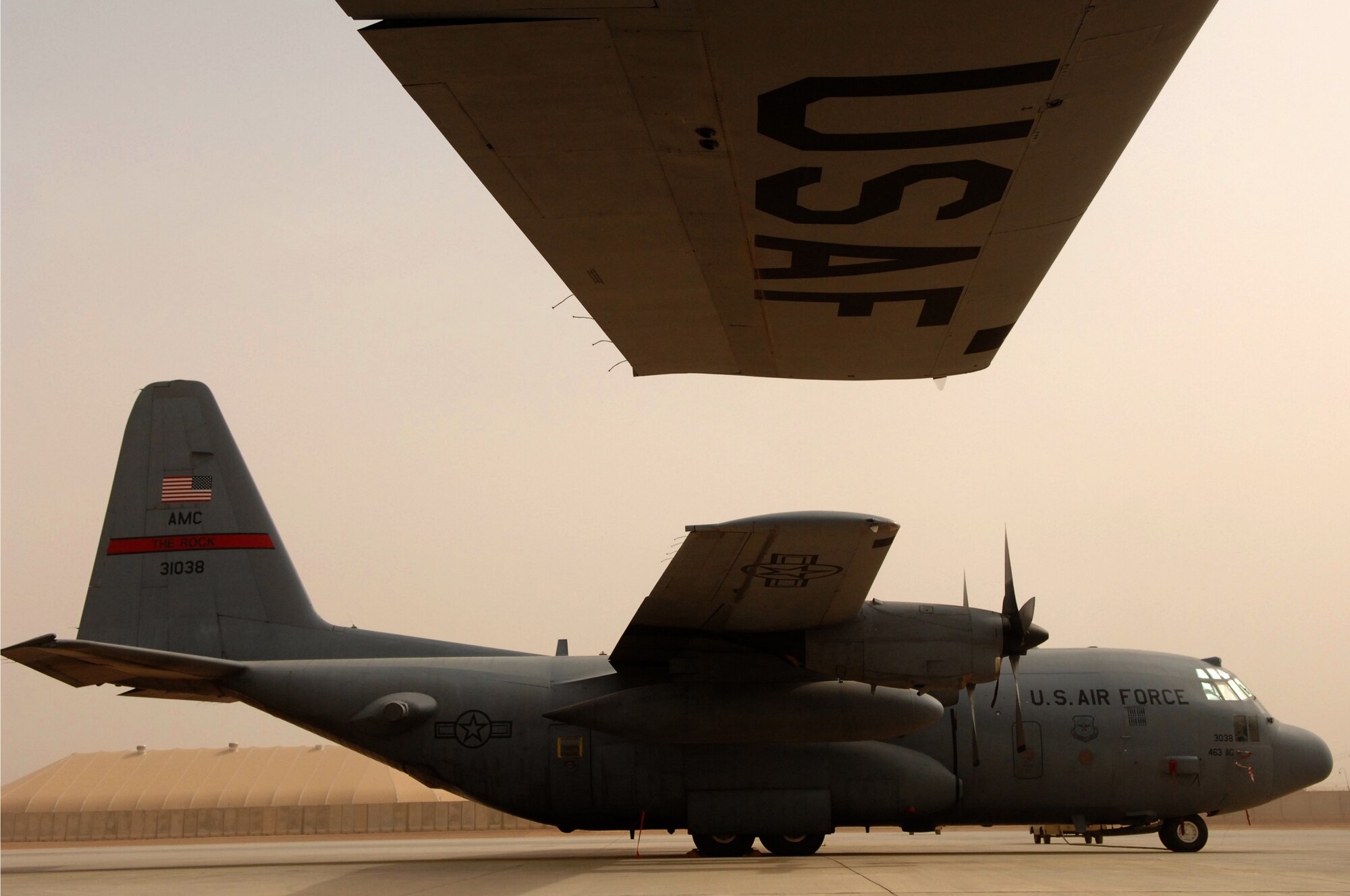 BALAD AIR BASE, Iraq -- A C-130 Hercules from Little Rock Air Force Base, Ark., sits on the airfield before a mission here, March 26. The C-130 Hercules provides intra-and inter-theater airlift, delivering passengers and cargo to bases around the country. The aircraft is used in a variety of critical missions to include supply, convoy reduction, aeromedical evacuation and special operations. Tactical airlift operations are currently flying at about twice the programmed peacetime rate. (U.S. Air Force photo/ Senior Airman Julianne Showalter)