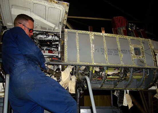 KUNSAN AIR BASE, Republic of Korea -- Tech. Sgt. Thomas Hartley deployed from the 649th Combat Logistics Support Squadron, Hill Air Force Base, Utah performs depot maintenance on an F-16 aircraft here March 25.  Depot maintenance is the highest level of maintenance, which involves changing major structure components of the aircraft.  (U.S. Air Force photo/ Master Sgt. Timothy Fugere)