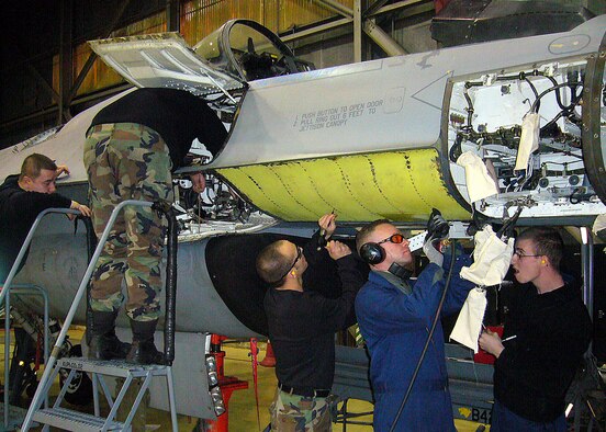 KUNSAN AIR BASE, Republic of Korea --  Maintainers deployed from the 649th Combat Logistics Support Squadron, Hill Air Force Base, Utah perform depot maintenance on an F-16 aircraft here March 25.  Depot maintenance is the highest level of maintenance, which involves changing major structure components of the aircraft.  (U.S. Air Force photo/Master Sgt. Timothy Fugere)