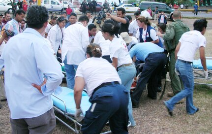 SOTO CANO AIR BASE, Honduras--The scene at Hospital Escuela in the Honduran capital Tegucigalpa was seems chaotic as the hospital staff, Honduran emergency medical technicians and Joint Task Force-Bravo MEDEVAC crew unloaded people injured in a bus crash site near Choluteca, Honduras Easter Sunday. During the MEDEVAC, the crew performed airway intubation and CPR on one patient who quit breathing during the flight. (U.S. Air Force photo)