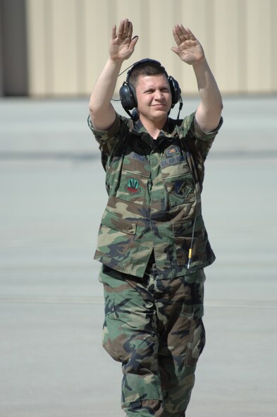Staff Sergeant Steven Utter marshals an F-117A Nighthawk during Exercise Coronet Gold Rush 08-02, March 28, 2008, Holloman Air Force Base, N.M.. Sgt Utter is a dedicated crew chief assigend to the 49th Aircraft Maintenance Squadron, 49th Maintenance Group. (U.S. Air Force photo/Senior Airman Anthony Nelson Jr) 