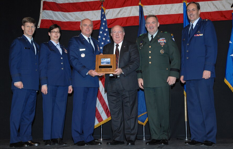 EIELSON AIR FORCE BASE, Alaska -- Gen. Carrol H. Chandler and military generals attending the 40th Annual Military Appreciation Banquet present Frederick "Butch" Stein with the Messer Award March 25 at the Carlson Center in Fairbanks, AK.  Mr. Stein received the award for outstanding support to the military communities of Interior Alaska.  (U.S. Air Force photo/Staff Sgt. Tia Schroeder)
