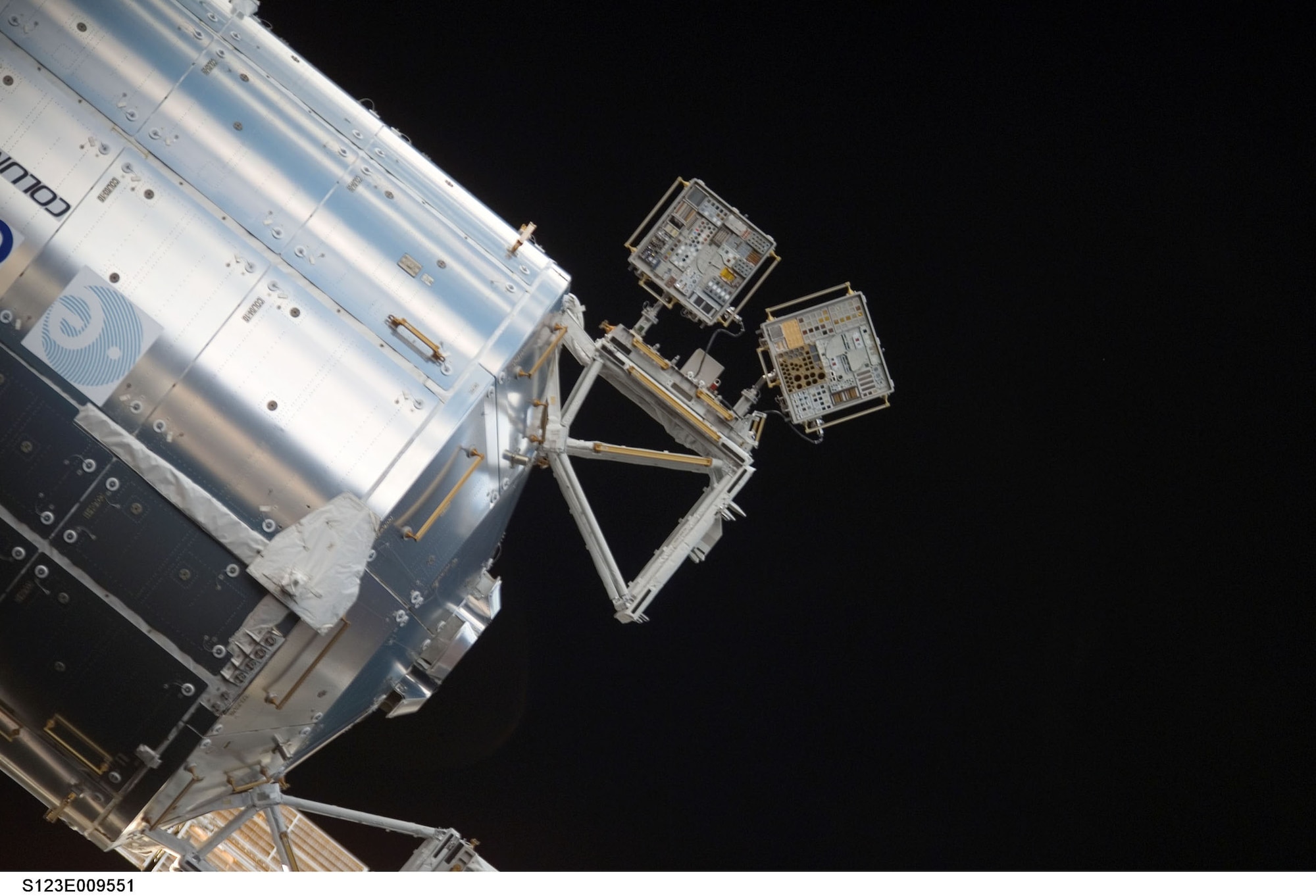 On March 22, an astronaut from the Space Shuttle Endeavor carried two small, passive experiment containers filled with various materials outside the shuttle and mounted them to the International Space Station for the sixth Materials International Space Station Experiment. The containers expose the new materials to space. After approximately one year, the samples will be retrieved and evaluated based on their reaction to atomic oxygen erosion, direct sunlight, radiation and extremes of heat and cold. (NASA photo) 