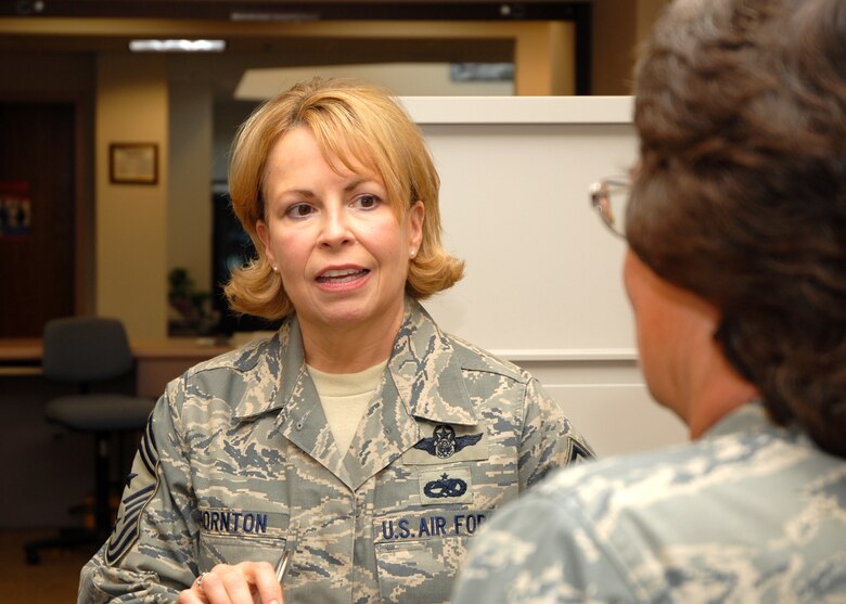 Air Force Reservist Chief Master Sgt. Patricia Thornton, 4th AF Command Chief, talks with Master Sgt. Barbara Neal, 940th Military Personnel Flight Career Enhancement chief, during the chief's visit to the 940th Air Refueling Wing at Beale Air Force Base, Calif. March 11, 2008.  The chief came to see the 940th's Reservists as they go through a Base Realignment and Closure Commission directed mission change. (U.S. Air Force photo/Stacey Knott)