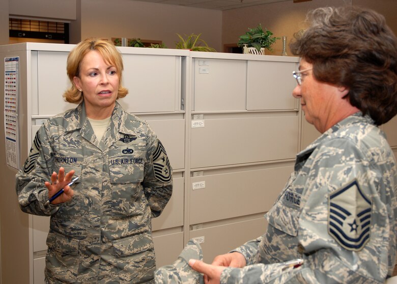 Air Force Reservist Chief Master Sgt. Patricia Thornton, 4th AF Command Chief, talks with Master Sgt. Barbara Neal, 940th Military Personnel Flight Career Enhancement chief, during the chief's visit to the 940th Air Refueling Wing at Beale Air Force Base, Calif. March 11, 2008.  The chief came to see the 940th's Reservists as they go through a Base Realignment and Closure Commission directed mission change. (U.S. Air Force photo/Stacey Knott)