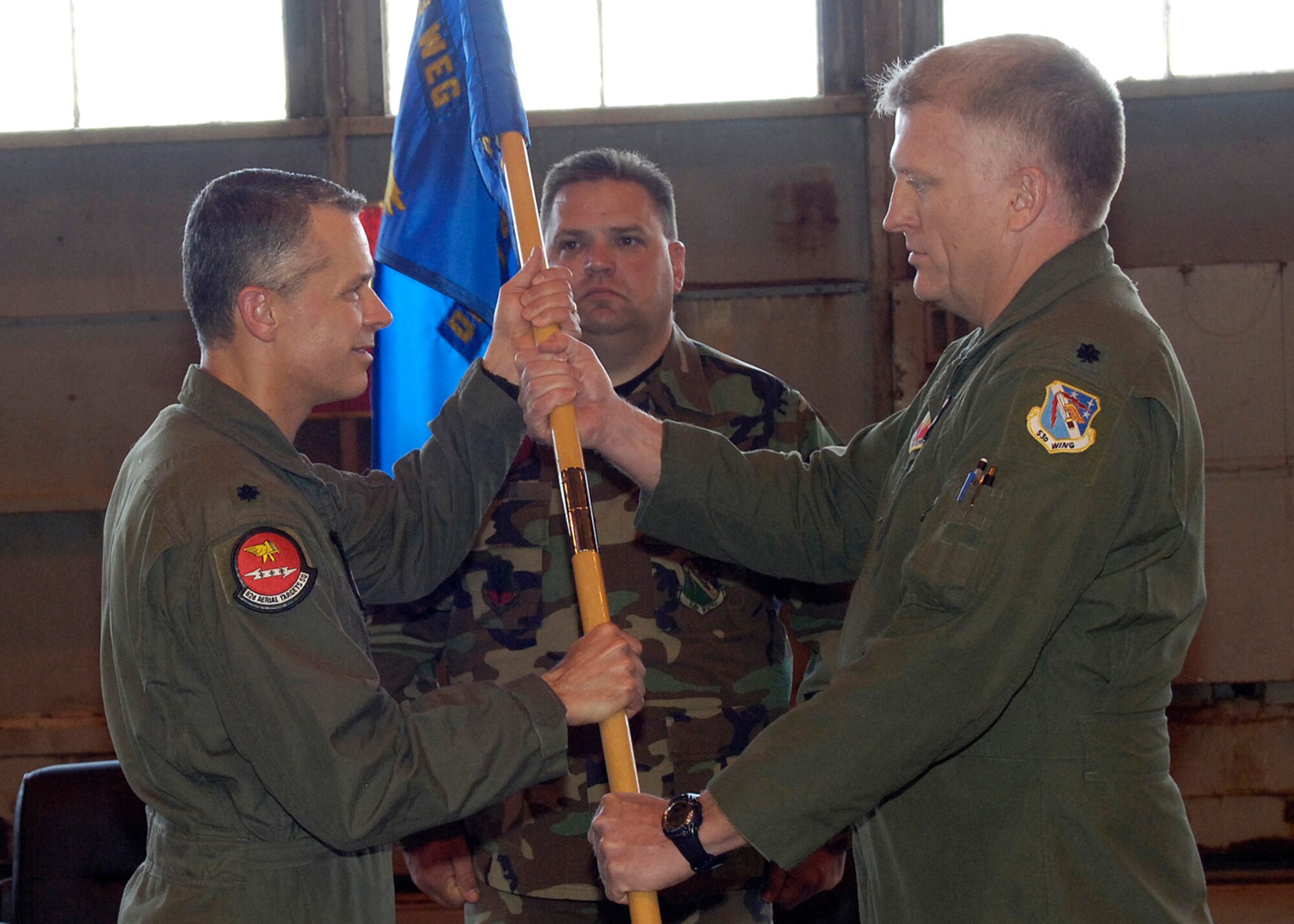Lt. Col. Joel C. Rush passes the guidon to Lt. Col. James D. Lee, and relinquishes command of Detachment 1, 82nd Aerial Target Squadron during a change of command ceremony March 21, 2008, at Holloman Air Force Base, N.M. (U.S. Air Force photo/Airman 1st Class Michael J. Means )