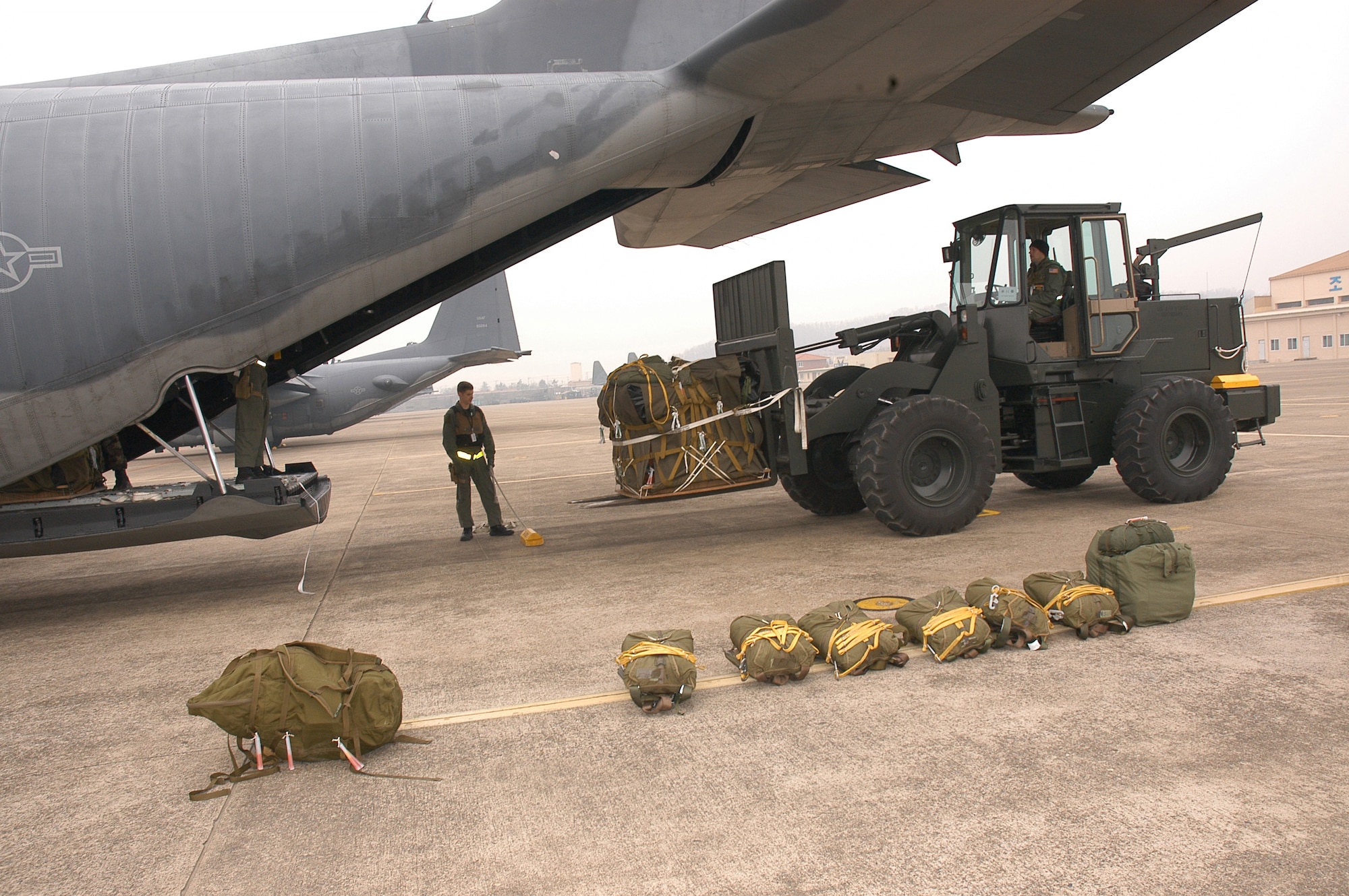 Members from Aerial Delivery of the 353rd Operations Support Squadron load an aircraft at Daegu Air Base, Korea.  Airdrops were inspected during the 353rd Special Operations Group?s operational readiness inspection.  The group is stationed at Kadena Air Base, Japan.                                