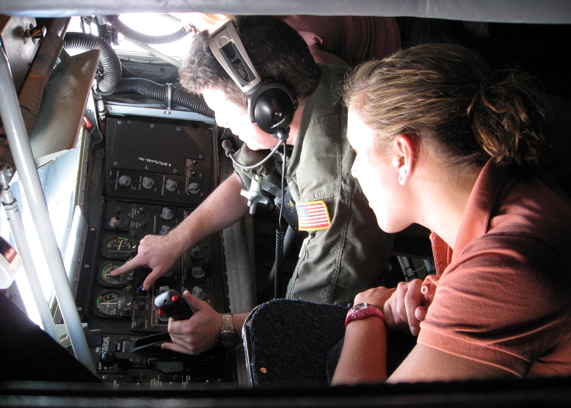 Tech. Sgt. Drennen Gaffney gives a 339th Recruiting Squadron Fly-Away Health Professions Tour guest a close look at KC-135 refueling boom operations in a 434th Air Reserve Wing aircraft March 15. The tour gave select doctors, dentists, nurses and medical school students from Michigan a first-hand look at the Air Force experience at Eglin Air Force Base, Fla., March 13-15. The Reserve unit based at Grissom Air Reserve Base, Ind., flew tour guests back to Michigan. (U.S. Air Force photo/Staff Sgt. Nathan Richardson)