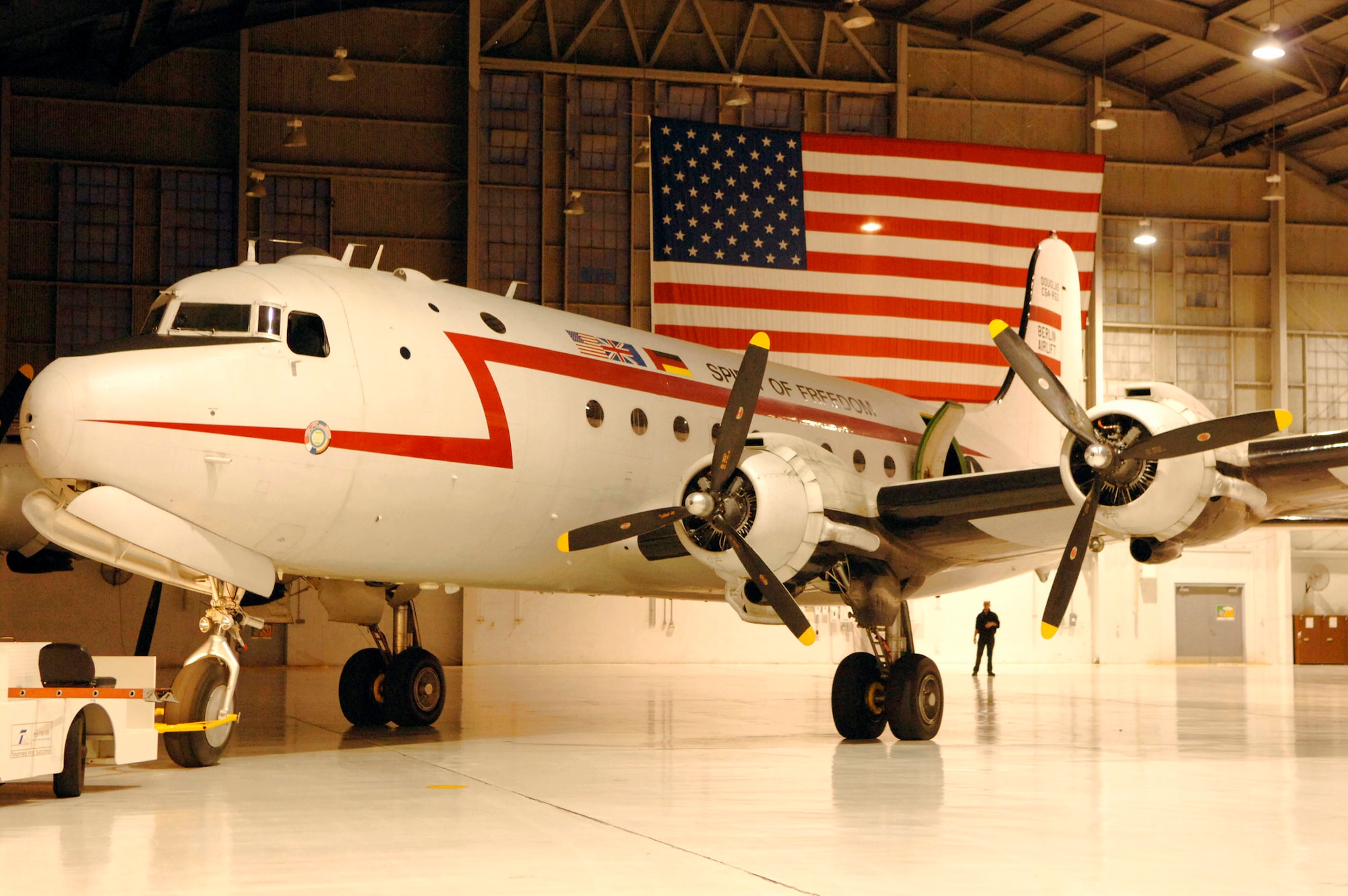 The C-54 Skymaster "Spirit of Freedom" gets backed into a hangar March 24 at MacDill Air Force Base, Fla. The "Spirit of Freedom" was used during the Berlin Airlift and was at MacDill AFB as part of Phoenix Rally. (U.S. Air Force photo/Staff Sgt. Joseph Swafford Jr.)