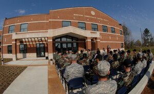 LANGLEY AIR FORCE BASE, Va. -- Langley troops await the opening of the munitions admistrative support facility during a ribbon cutting ceremony here March 28.  Ammunitions troops will work out of the new administrative building when not performing maintenance or inspections.  (U.S. Air Force photo/Senior Airman Cecil C. McCloud)