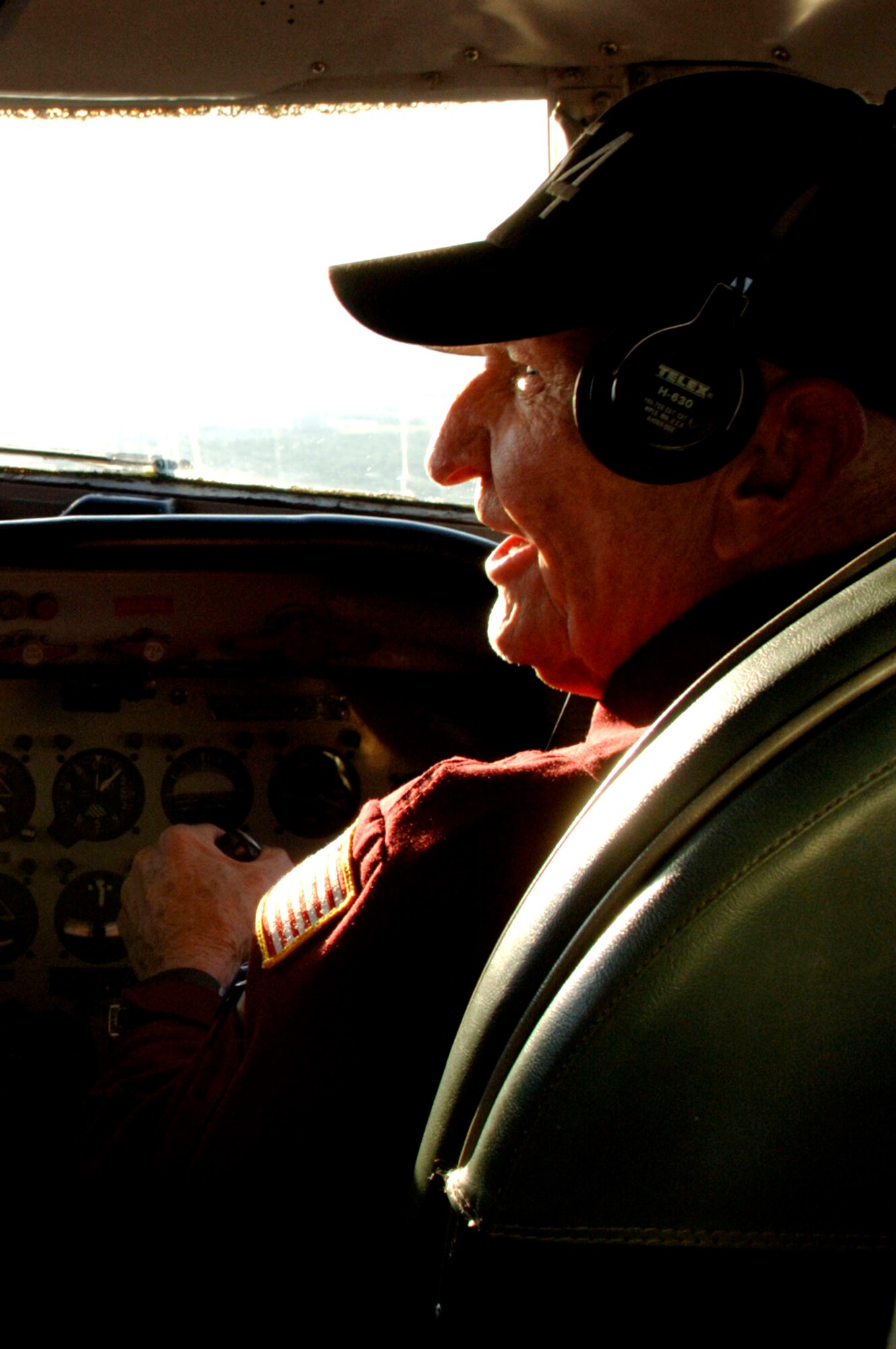 Retired Col. Gail Halvorsen pilots the C-54 Skymaster "Spirit of Freedom" March 24 over Tampa, Fla. Colonel Halvorsen was known as the Berlin Candy Bomber during the Berlin Airlift and was perfoming a fly over during a New York Yankee spring training game to kick off Phoenix Rally. (U.S. Air Force photo/Staff Sgt. Joseph Swafford Jr.)  