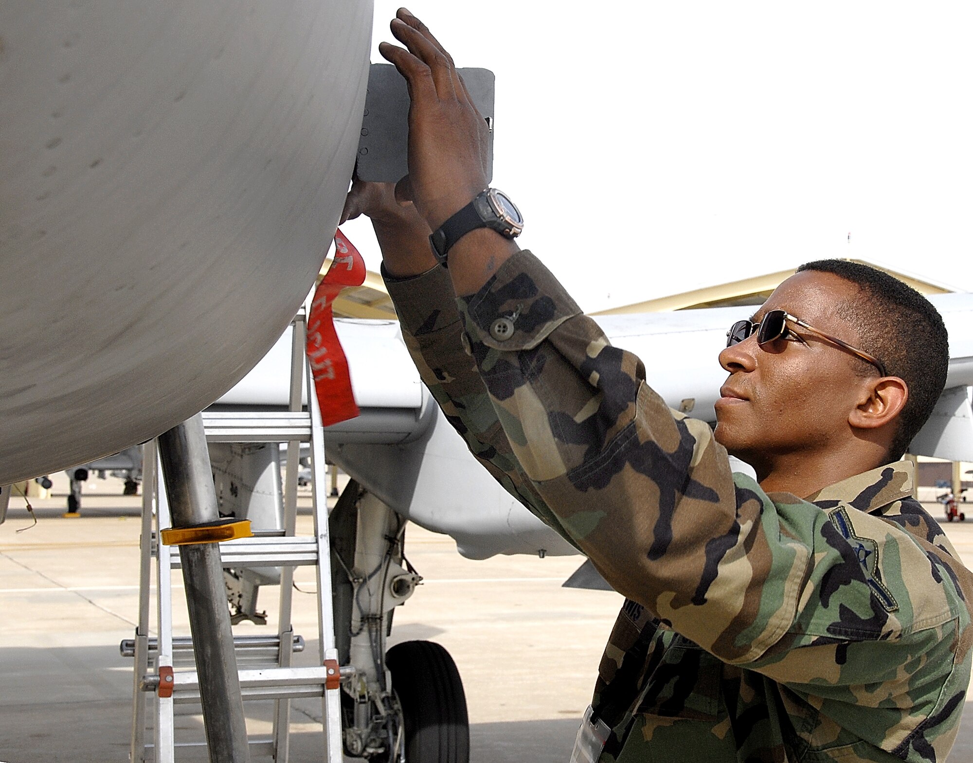 WHITEMAN AIR FORCE BASE, Mo. -- Airman Ty Lewis, an A-10 Thunderbolt II crew chief with the 442nd Fighter wing here, closes an access panel on the aircraft he is assigned to as he completes his work for the day. The 442nd Fighter Wing is an Air Force Reserve Command unit at Whiteman with more than 1000 Air Force reservists assigned. For more information on how to join the 442nd call (660) 687-4014 or via email send to james.fritzen@whiteman.af.mil. (US Air Force photo/Master Sgt. Bill Huntington)