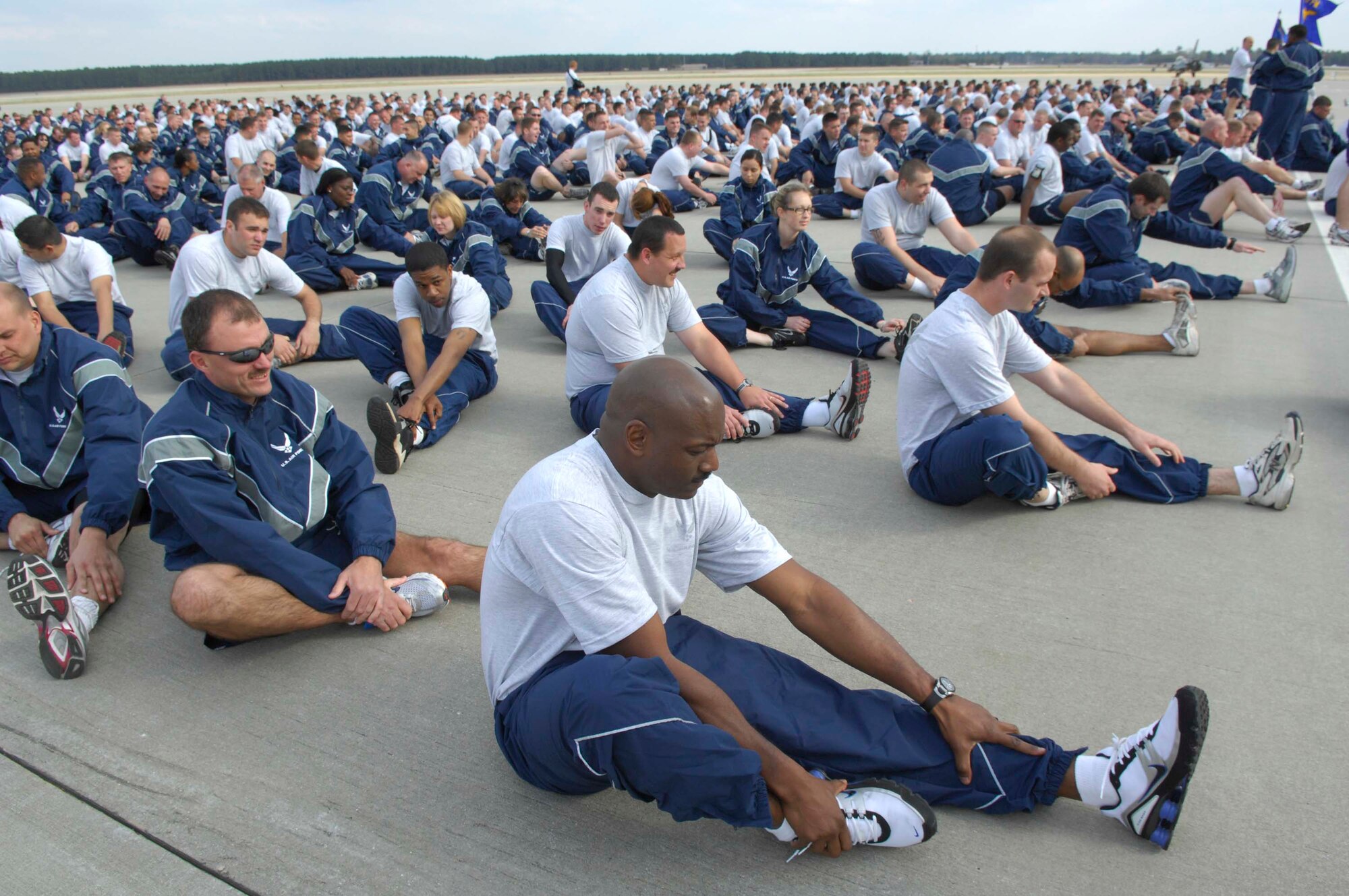 SHAW AIR FORCE BASE, S.C.-- Airmen of the 20th Figher Wing stretch prior to the start of a 3.1 mile valor run on the flight line recently. The valor run promotes wing-wide esprit de corps and camaraderie.  Physical fitness is a key factor in maintaining air expeditionary readiness. (U.S. Air Force photo/Tech Sgt. Josef Cole III)