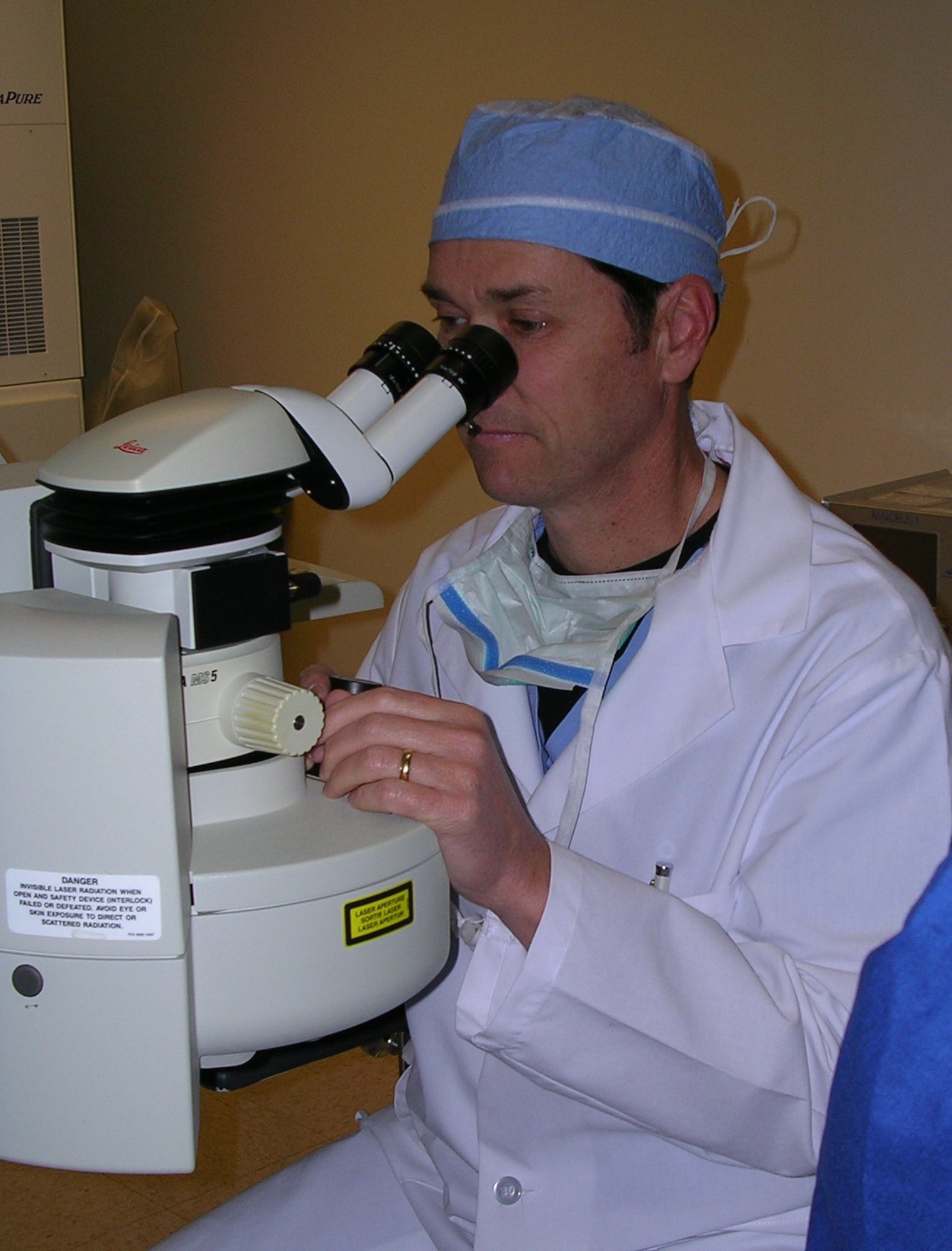 Dr. (Col) Leo D. Hurley, OD, MD, Chief Ophthalmology and Refractive Surgery; Commander , Surgical Specialties Flight, at the controls of the Excimer Laser. (Air Force photo)