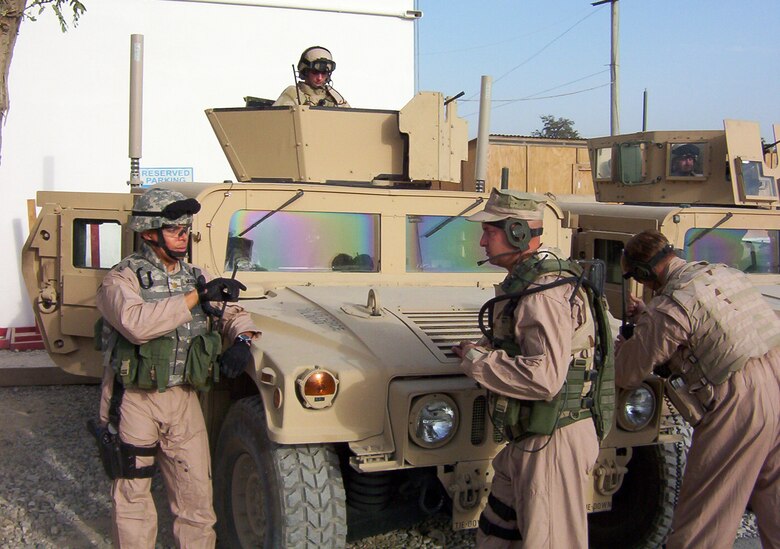 Maj. Herb Meadows speaks with a team leader prior to a tactical security escort mission at Bagram AB. The major recently returned from a six-month deployment to Afghanistan to support Operation Enduring Freedom as the 455th ESFS commander. (Courtesy Air Force photo)