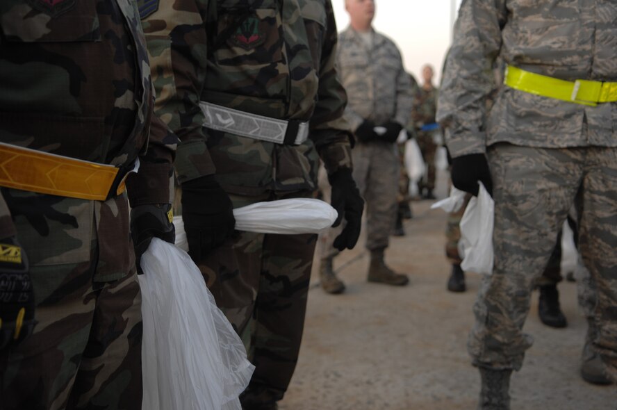 MOODY AIR FORCE BASE, Ga. – Airmen of the 23rd Wing listen to instructions before a Wing-wide foreign object debris walk here March 28.  Regularly scheduled FOD walks prevent damage to an aircraft's engines or tires from things like stones, screws and other sharp objects. (U.S. Air Force photo by Senior Airman Angelita Lawrence)