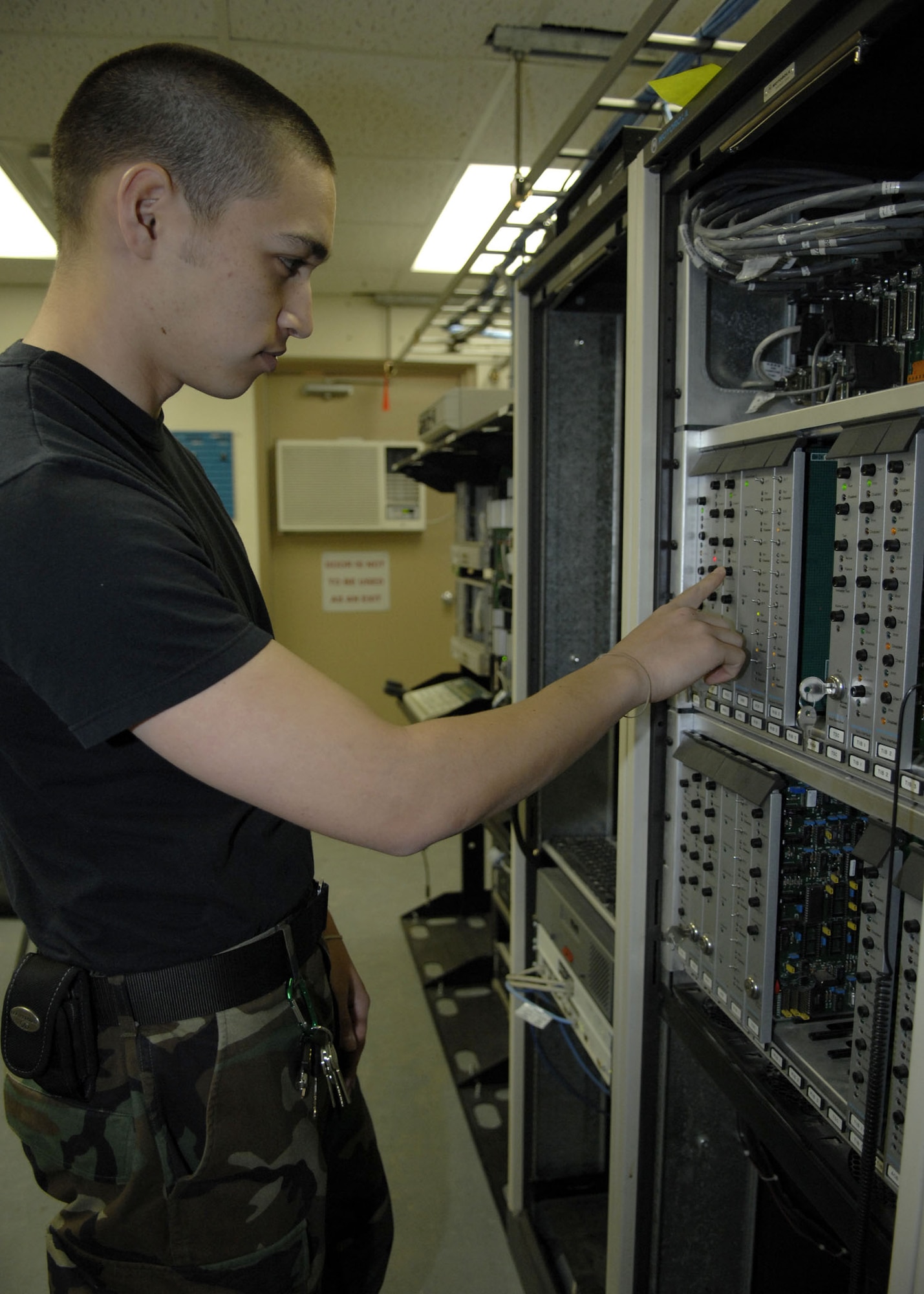 Airman David Hatch, radio maintenance apprentice, resets the channels on a land mobile radio trunking syste, at Holloman Air Force Base, N.M., March 24, 2008. (U.S. Air Force photo by Airman 1st Class Rachel A. Kocin)