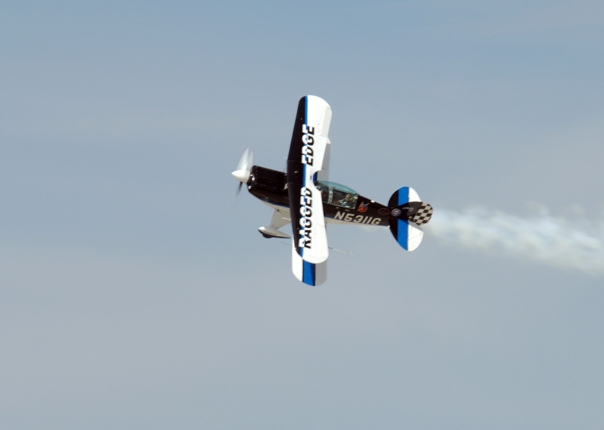DYESS AIR FORCE BASE, Texas-- The Ragged Edge aircraft performs a fly over, March 22. The Ragged Edge is an acrobatic aircraft that will be performing at the Big Country Airfest, May 3rd, gates open at 8:00am. (U.S. Air Force photo by Senior Airman Courtney Richardson)