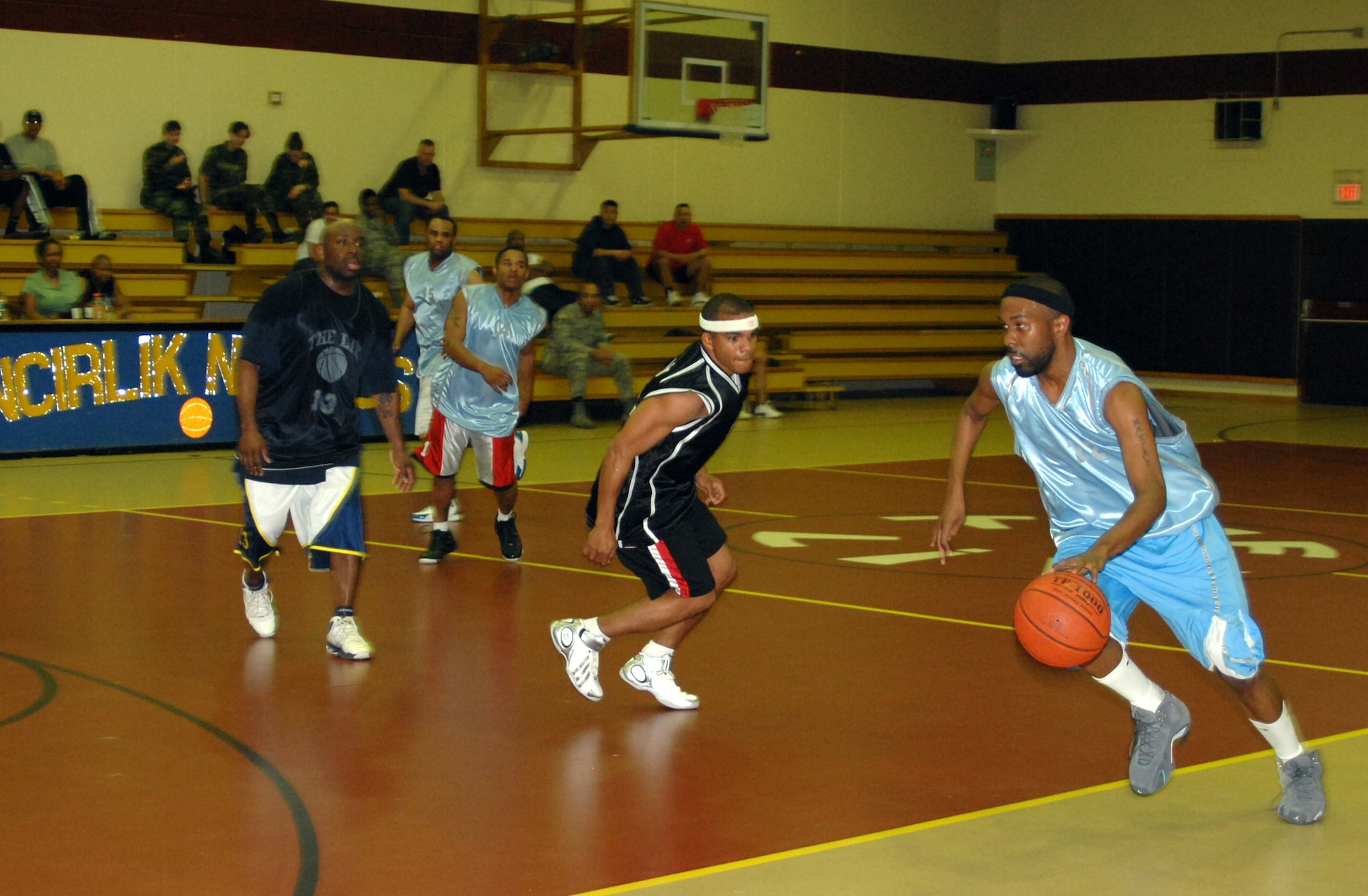 Marty Mosley, 39th Medical Group team, drives toward the net during the first of two games vs. the 39th Civil Engineer, Mission Support and Services Squadron combined basketball team, for the Intramural Championship March 25. Mosley had a combined total of 31 points for the two games. (Photo by Airman 1st Class Benjamin Wilson.)