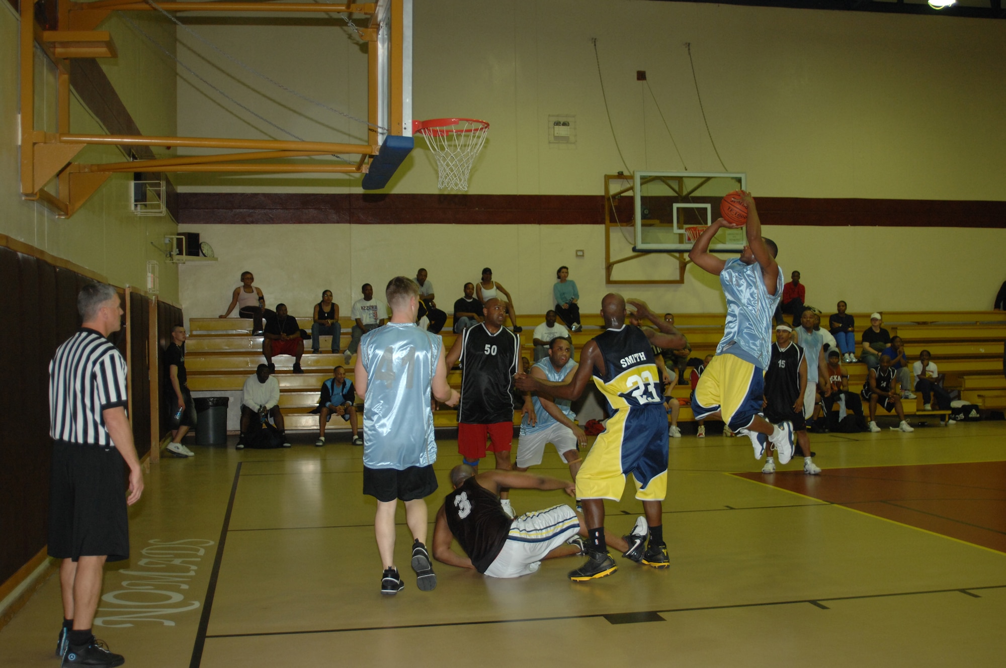 Byron Owens, 39th Medical Group team, goes for a two-pointer during the first game of the Intramural Championship game vs. the 39th Civil Engineer, Mission Support and Services Squadron combined basketball team March 25. MDG won the Championship by beating CES/MSS/SVS 61-51, in the first game and 70-57 in the second game. (Photo by Airman 1st Class Benjamin Wilson.)