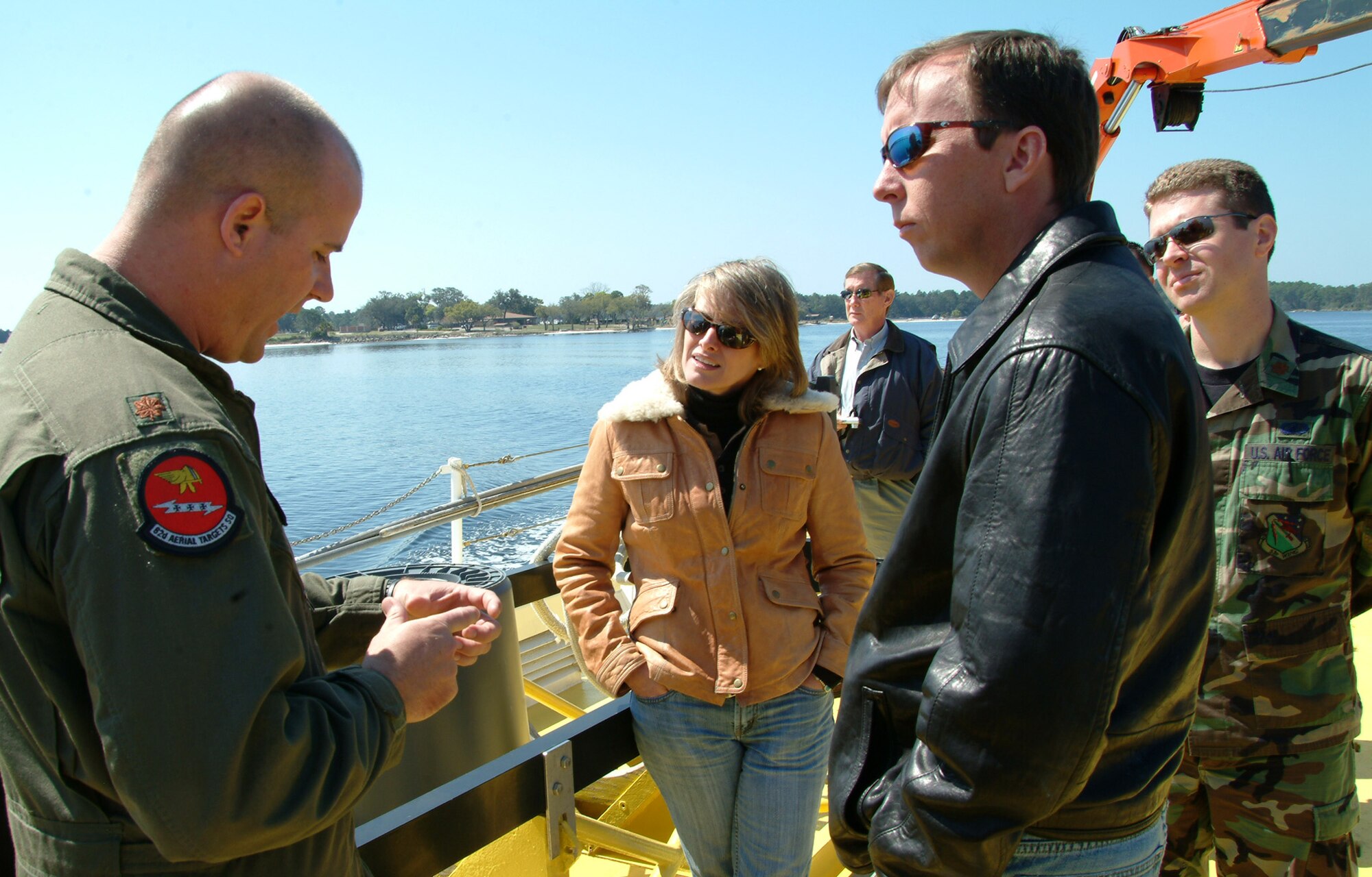 Maj. Kevin Brackin, 82nd Aerial Targets Squadron, explains the sub-scale drone recovery process to Jeanne Dailey, 68th Electronic Warfare Squadron honorary commander, Brett Hinely, 53d Wing honorary commander alumni president and Maj. Eric Furman, 68th EWS, during the honorary squadron commander’s tour of the 53d Weapons Evaluation Group facilities at Tyndall Air Force Base Fla.  Photo by Staff Sgt. Samuel King Jr.