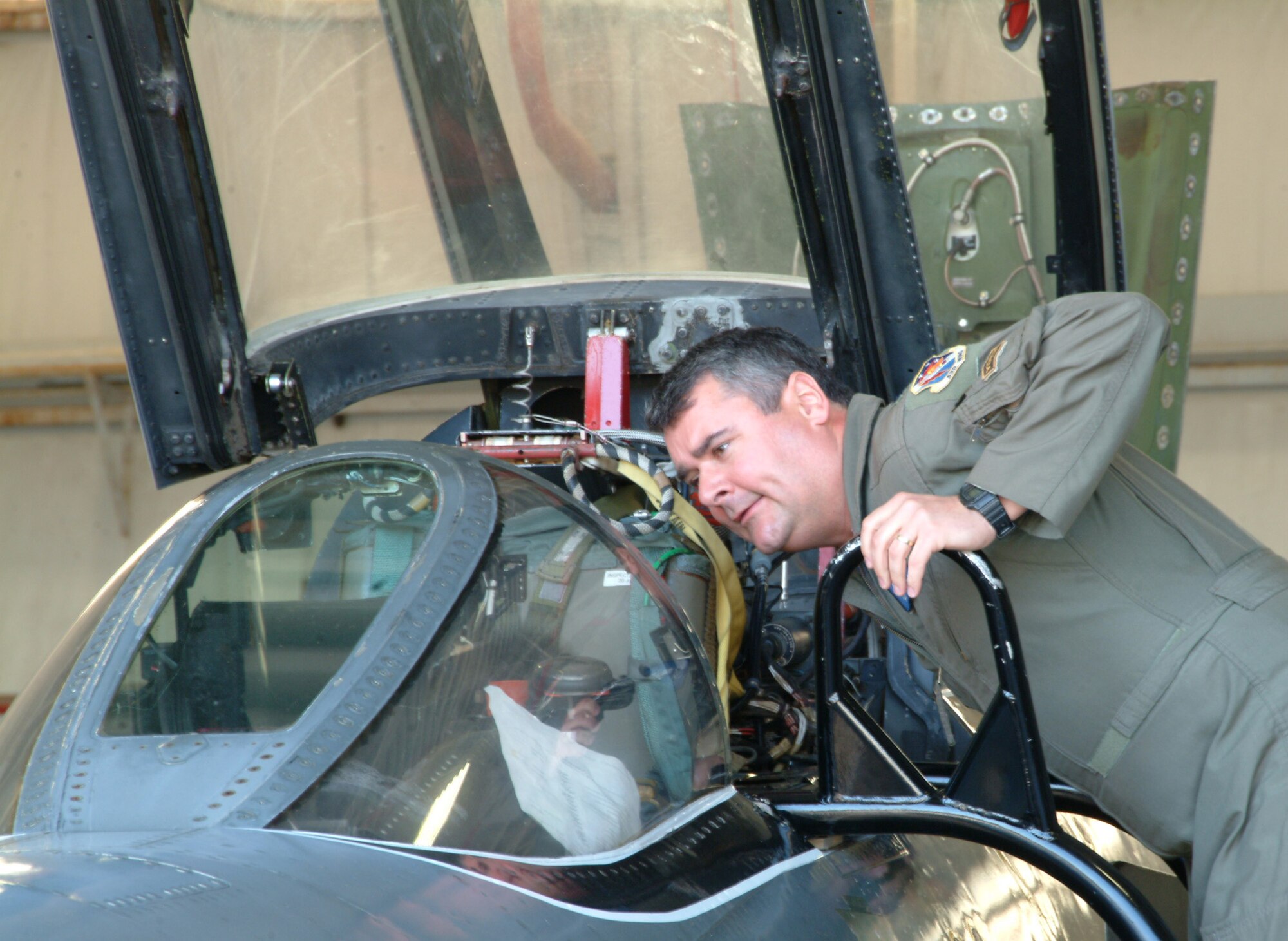 Lt. Col. John Arnold, 36th Electronic Warfare Squadron, visits an old friend – a QF-4 during the honorary squadron commander’s tour of the 53d Weapons Evaluation Group facilities at Tyndall Air Force Base Fla.  Colonel Arnold flew F-4s from 1994 - 1996 as a captain at Nellis Air Force Base, Nev.  Photo by Master Sgt. Andrew Leonhard.