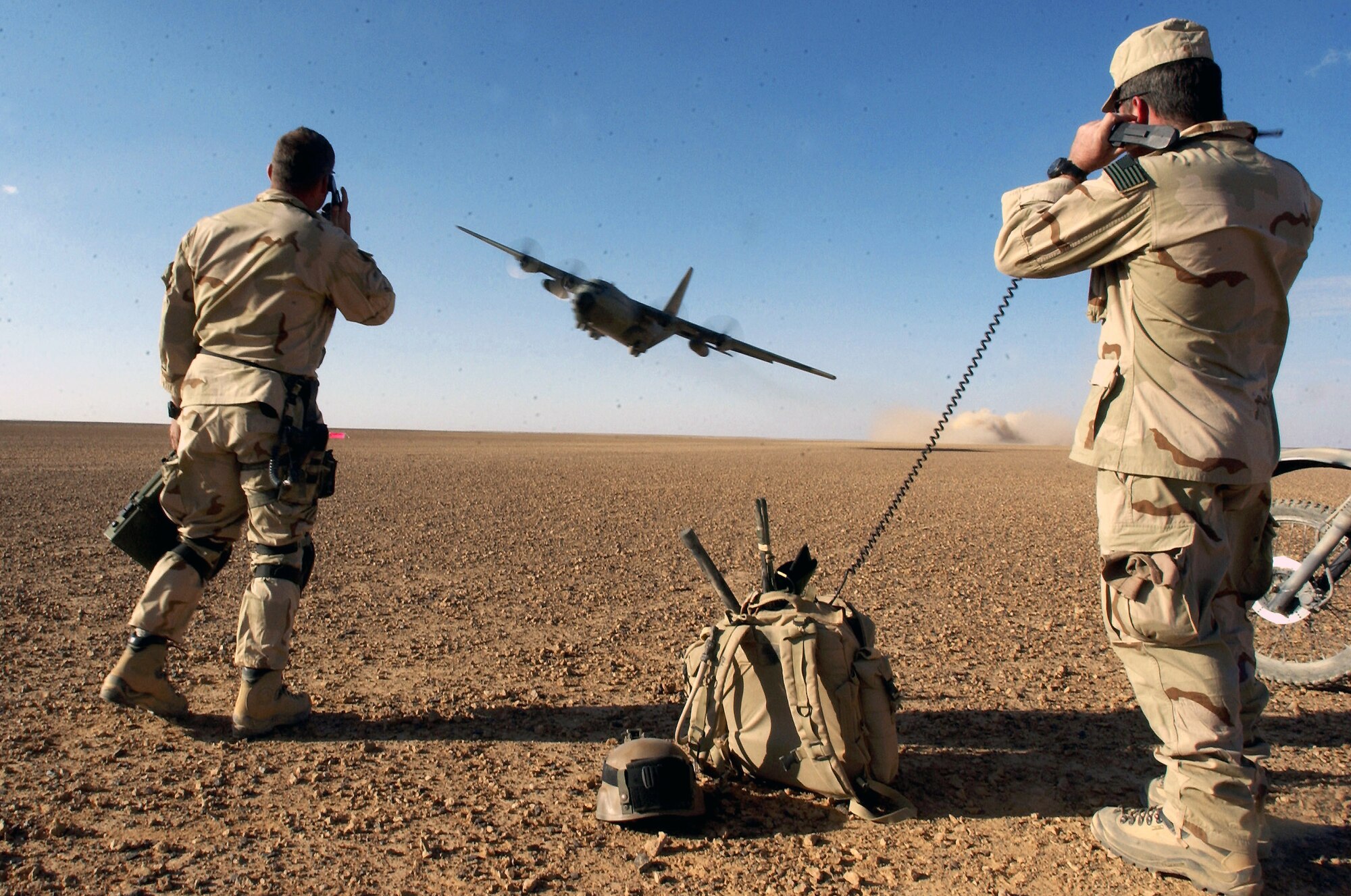 Air Force Special Operations Command combat controllers give a C-130 Hercules take off clearance and provide air traffic control during a mission to establish and assess an airfield March 15 at a forward deployed location in support of Operation Enduring Freedom.  (U.S. Air Force photo/Staff Sgt. Jeremy T. Lock) 