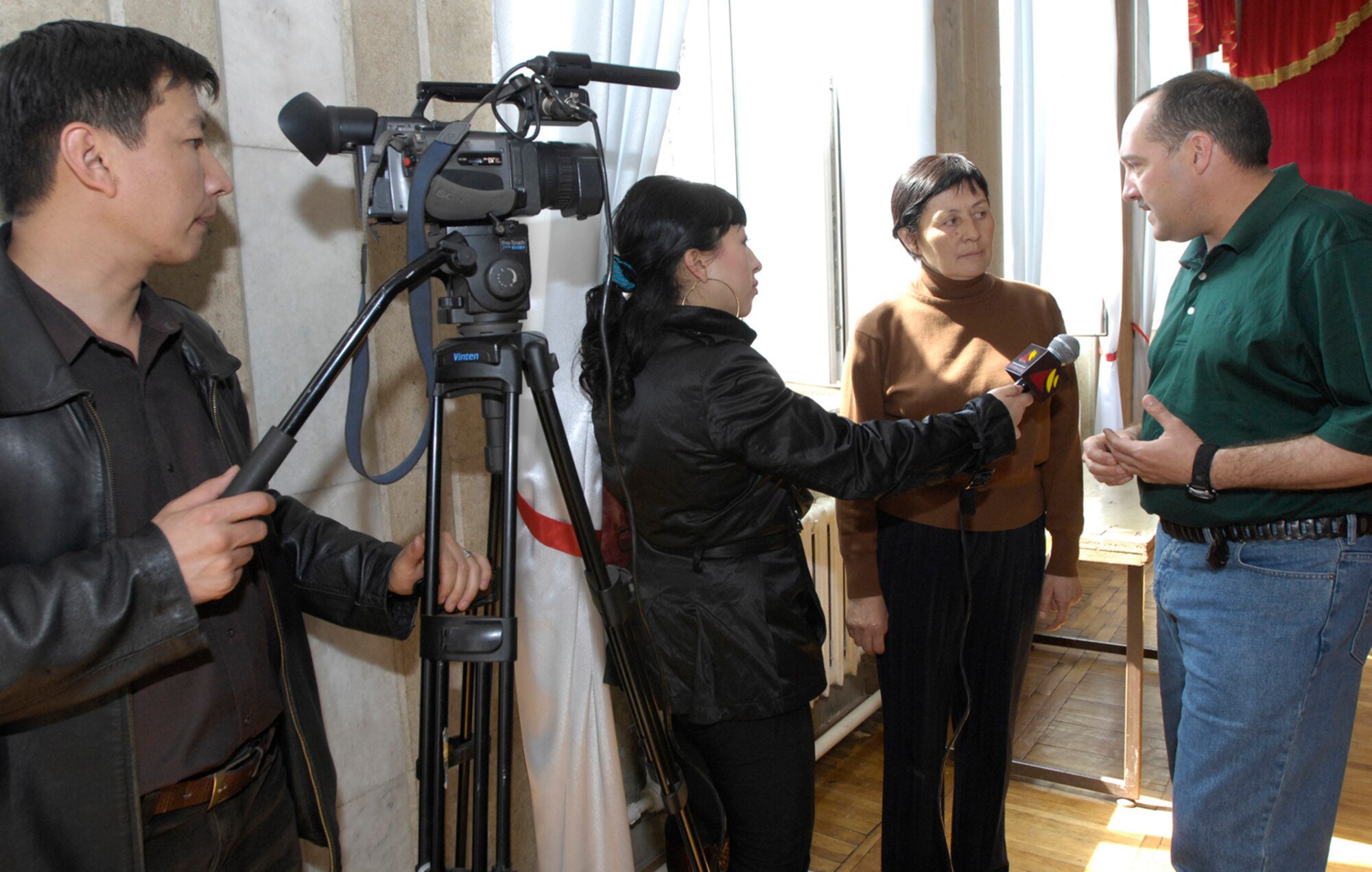 Master Sergeant Dean Smith, the operations manager for the U.S. Air Force Central Band "Hot Brass," is interviewed on March 26, 2008 by Pyramid, a Bishkek television station. "Hot Brass" performed at the Bishkek College of Music as well other locations off-base during their six-day trip to Kyrgyzstan. (Air Force photo by Senior Airman Tabitha Kuykendall) 
