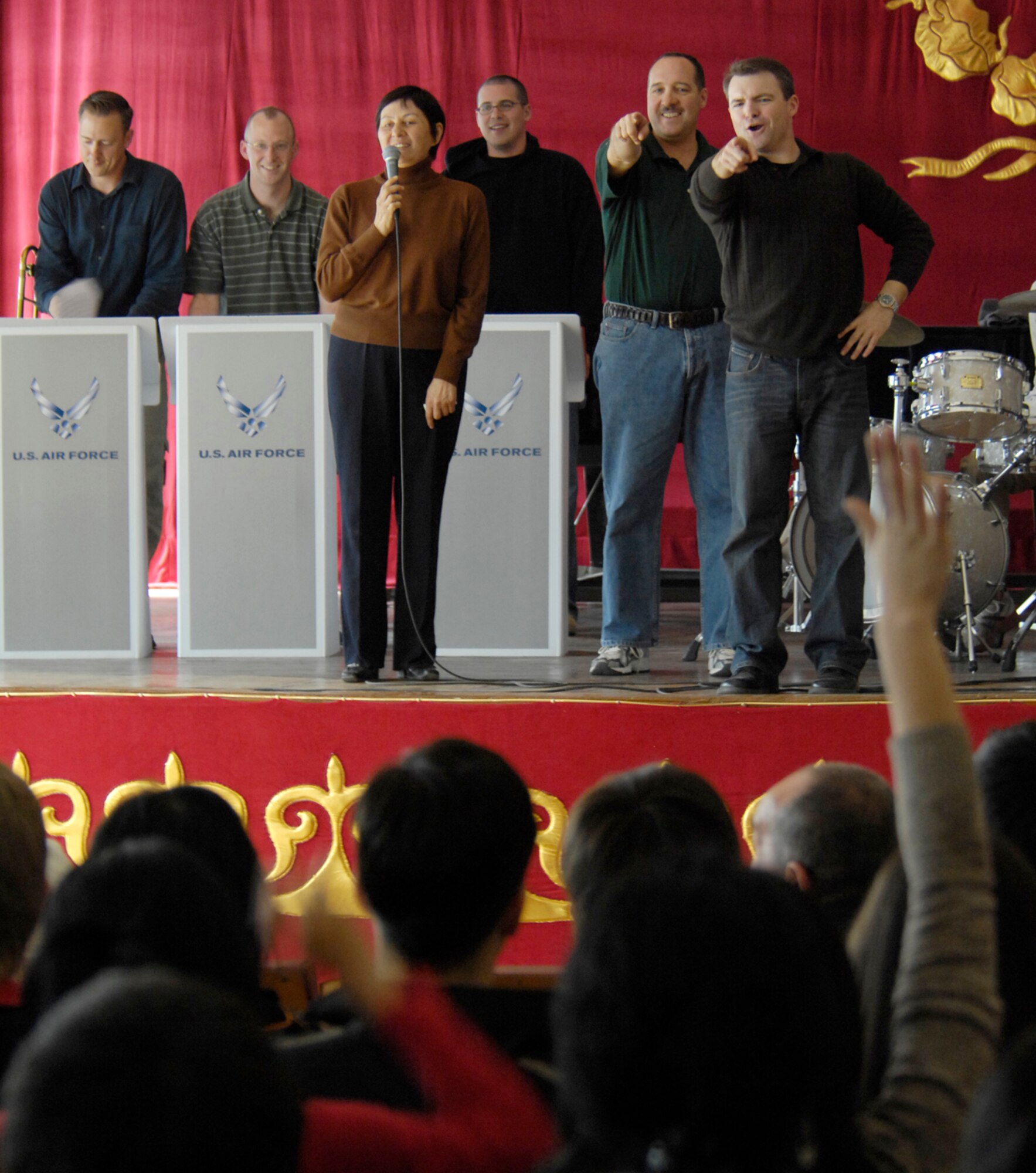The U.S. Air Forces Central Band "Hot Brass" gets the audience involved during their performance for Bishkek College of Music, Kyrgyzstan on March 26, 2008. "Hot Brass" performed for Manas Air Base Airmen and local villages and schools during their six-day trip to Kyrgyzstan. (Air Force photo by Senior Airman Tabitha Kuykendall) 