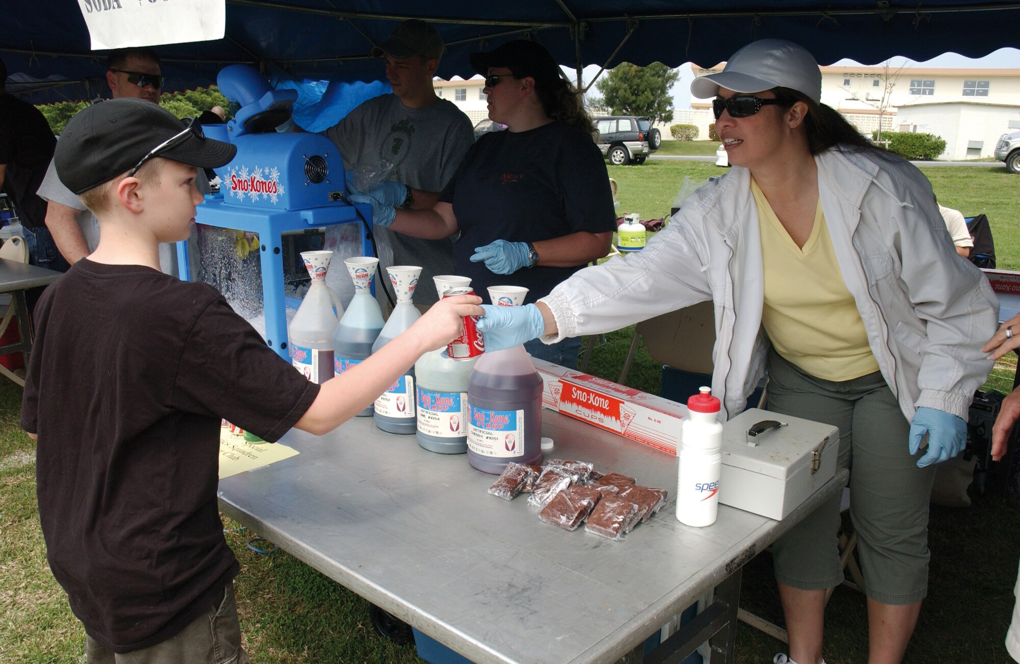 Terry Clark, wife of Master Sgt. Derrick Clark 320th Special Tactics Squadron First Shirt, hands out drinks and other goodies during the 2008 Spring Fest, March 22.  Every year Kadena Services hosts the festival to usher in the new year and before kids are dismissed from school for spring break.  The festival showcased many of Kadena's units  as they volunteered to set up and work booths of food, games and crafts.                                        
(U.S. Air Force photo/Senior Airman Jeremy McGuffin) 