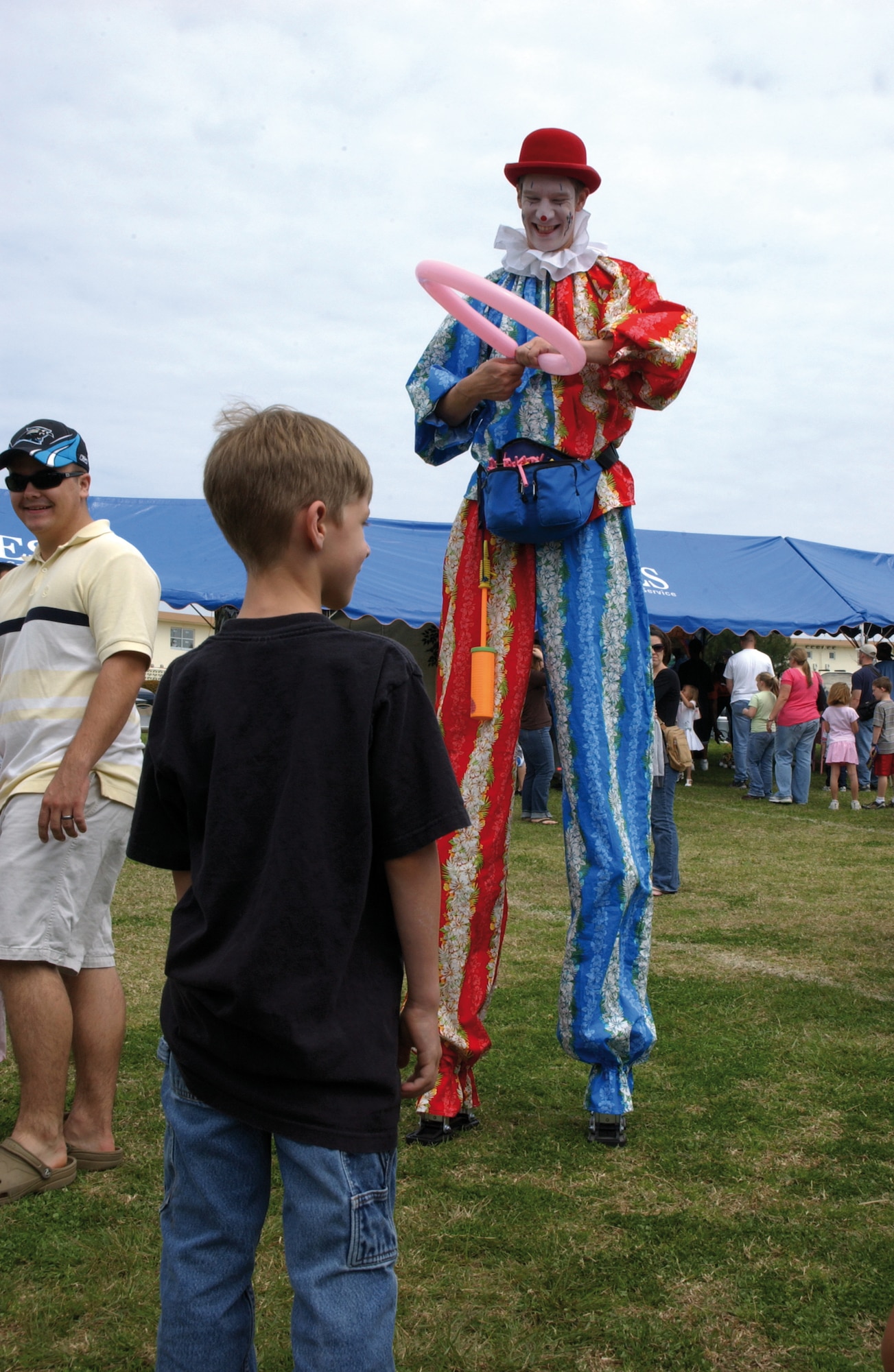 Clowns making balloon animals, swords and other items for kids were just one of many attractions during the 2008 Spring Fest, March 22.  Every year Kadena Services hosts the festival to usher in the new year and before kids are dismissed from school for spring break.  The festival showcased many of Kadena's units  as they volunteered to set up and work booths of food, games and crafts.                 
(U.S. Air Force photo/Senior Airman Jeremy McGuffin) 