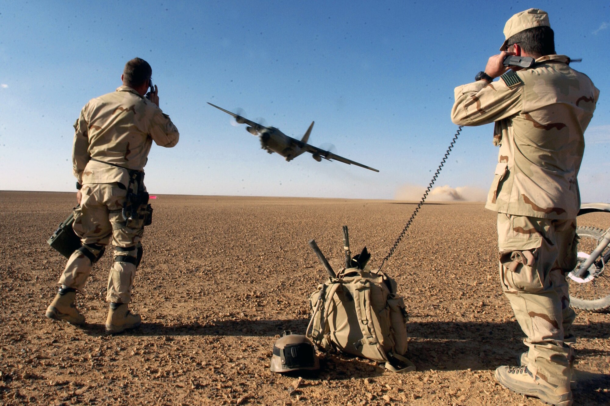 Air Force Special Operations Command combat controllers give a C-130 Hercules take off clearance and provide air traffic control during a mission to establish and assess an airfield March 15 at a forward deployed location in support of Operation Enduring Freedom.  (U.S. Air Force photo/Staff Sgt. Jeremy T. Lock) 