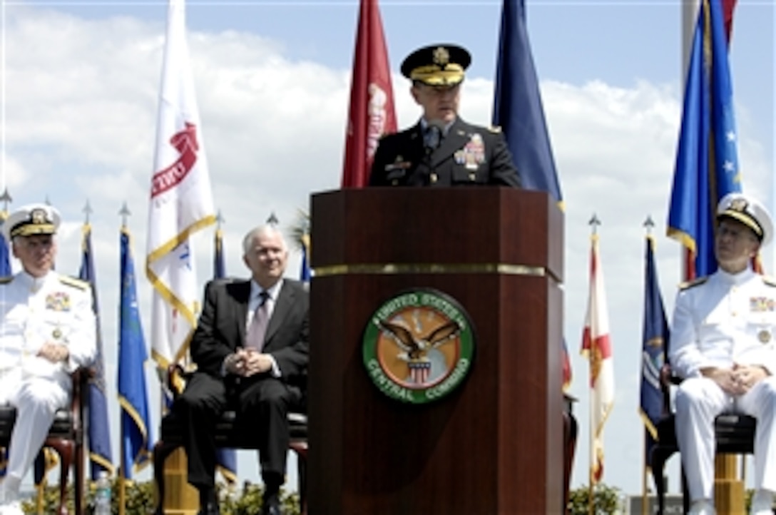 Army Lt. Gen. Martin Dempsey, acting commander of U.S. Central Command, addresses the audience as Navy Adm. William J. Fallon, left, outgoing commander of U.S. CENTCOM, Defense Secretary Robert M. Gates, center, and Navy Adm. Mike Mullen, chairman of the Joint Chiefs of Staff, right, look on during a ceremony on MacDill Air Force Base, Fla., March 28, 2008.