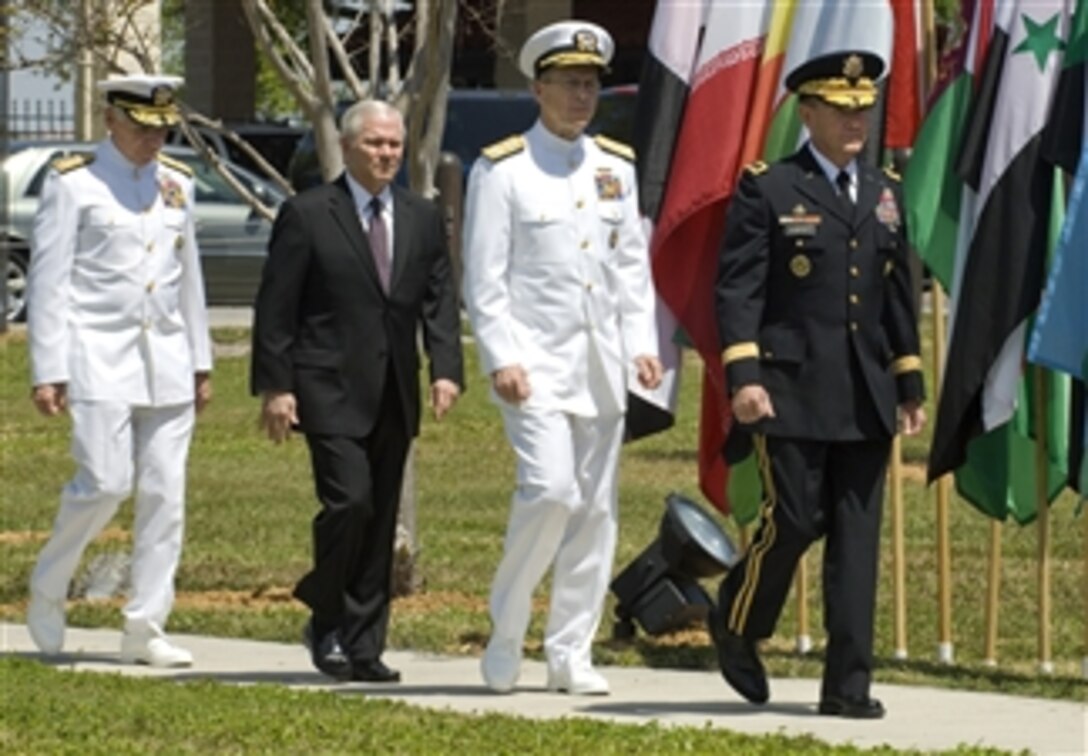 Defense Secretary Robert M. Gates, center, walks with Navy Adm. William J. Fallon, left, outgoing commander of U.S. Central Command, Navy Adm. Mike Mullen, right, chairman of the Joint Chiefs of Staff, and Army Lt. Gen. Martin Dempsey, during a relinquishment of command ceremony at MacDill Air Force Base, Fla., March 28, 2008.