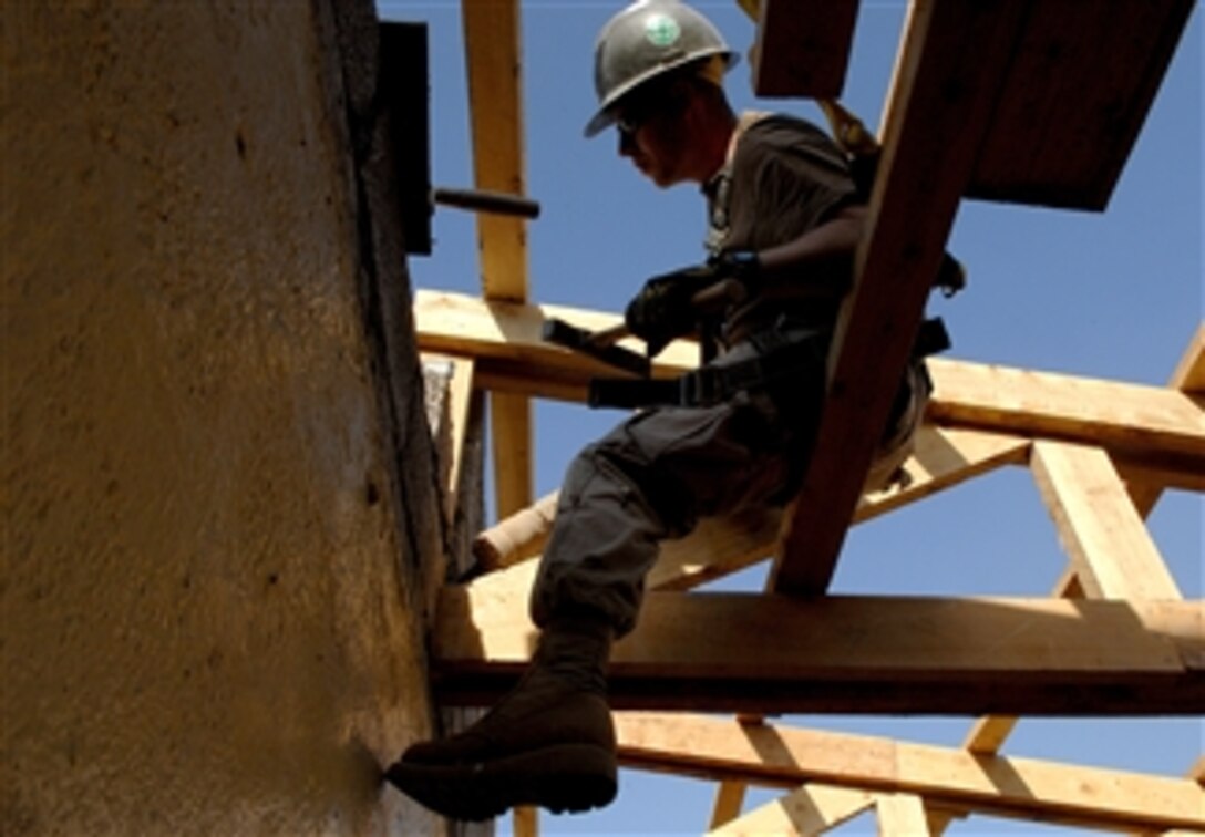 U.S. Navy Seaman Patrick Dixon builds a back wall on the administration building of the Abadir Primary School in Addis Ababa, Ethiopia, March 18, 2008.  Dixon is assigned to Naval Mobile Construction Battalion 74, which is conducting a Combined Joint Task Force - Horn of Africa community service project.