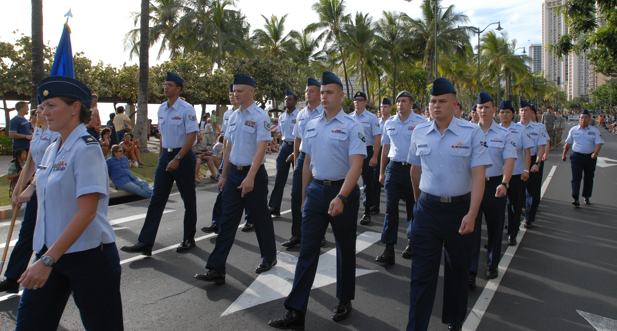 Members of the 15th Airlift Wing and Team Hickam marched down Waikiki’s Kalakaua Avenue as part of the Prince Jonah Kuhio Kalanina’ole Commemorative Parade on Saturday.  The Air Force flight was led by Maj. Marianne Hafler, 15th Aeromedical Dental Squadron. (U.S. Air Force photo by Master Sgt Robert Burgess) 