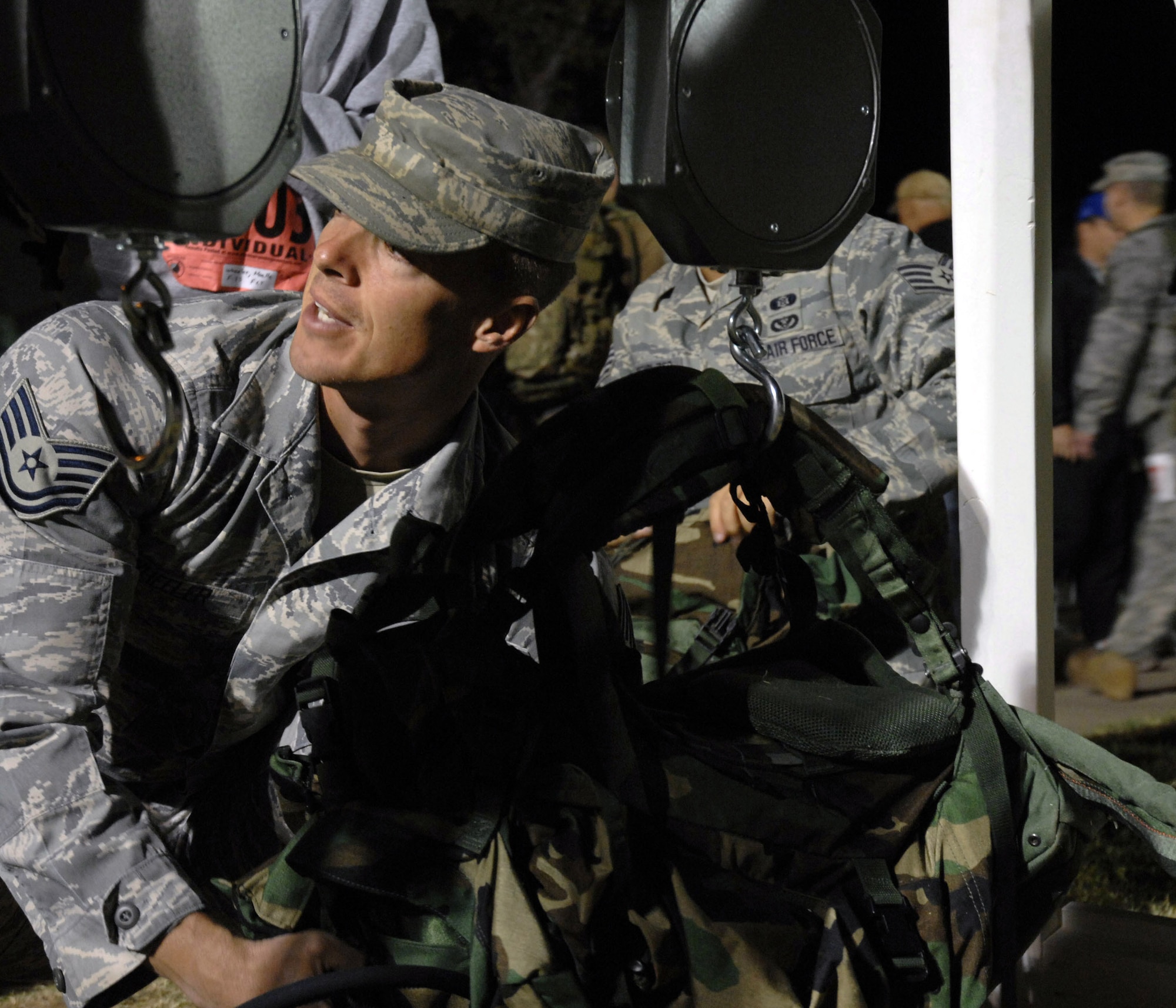 Tech. Sgt. Daniel Wheeler weighs his rucksack before beginning the 19th Annual Bataan Death Memorial Death March March 30 at White Sands Missile Range, N.M. More than 4,400 runners and marchers participated in the 26.2 or 15-mile run/walk. Sergeant Wheeler is assigned to the 737th Training Squadron from Lackland AFB, Texas. (U.S. Air Force photo/Airman 1st Class Evelyn Chavez) 
