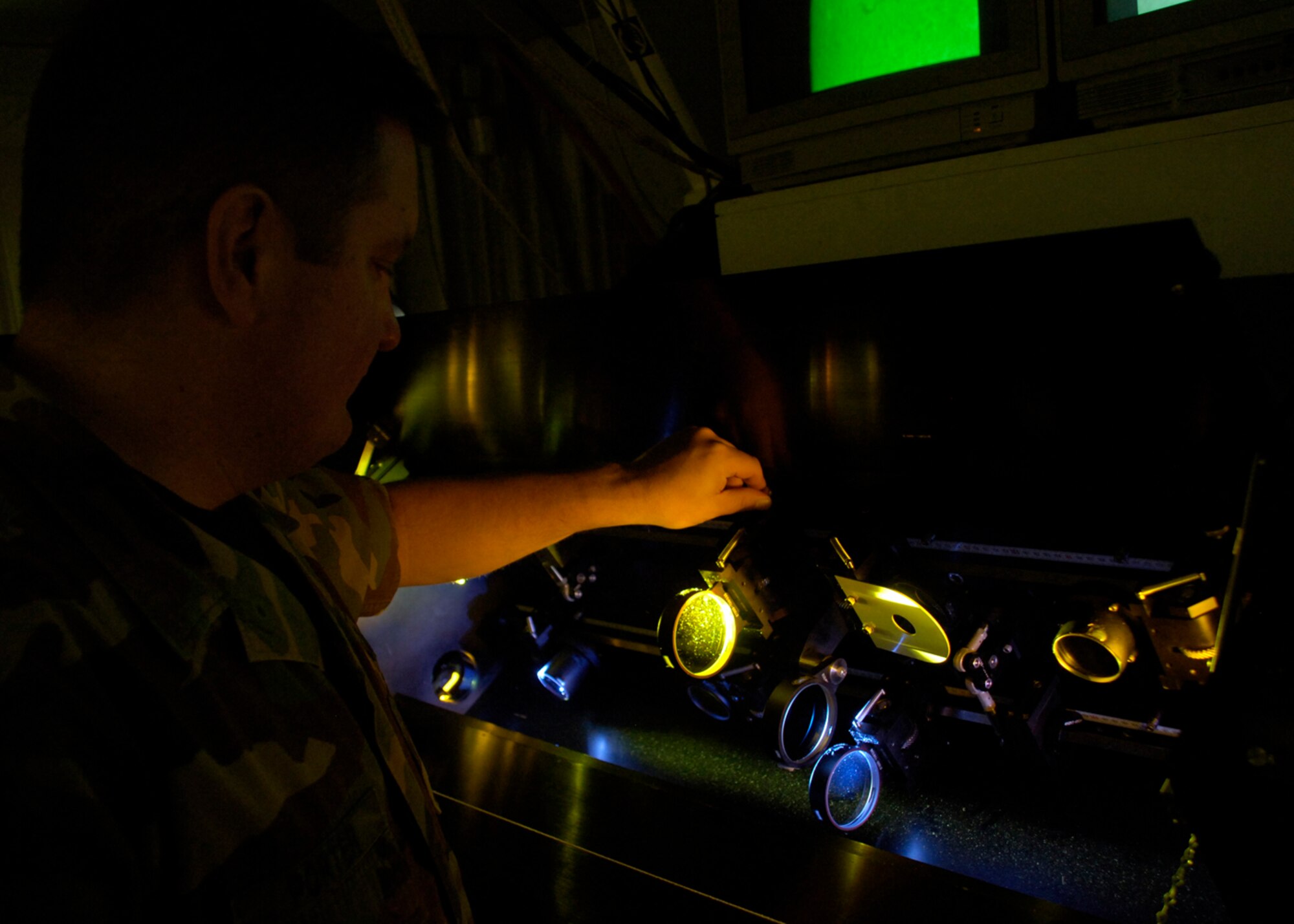 Staff Sgt. Gary Porter, Det 4, Air Force Weather Agency, adjusts the focus of the solar camera at the solar observatory March 26, 2008, at Holloman Air Force Base, N.M. (U.S. Air Force photo/Airman 1st Class Michael J. Means )
