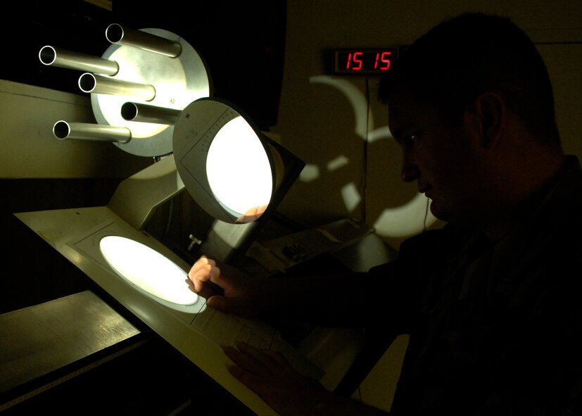 Staff Sgt. Gary Porter, Det 4, Air Force Weather Agency, charts sun spots displayed by the solar telescope at the solar observatory March 26, 2008, at Holloman Air Force Base, N.M. (U.S. Air Force photo/Airman 1st Class Michael J. Means )