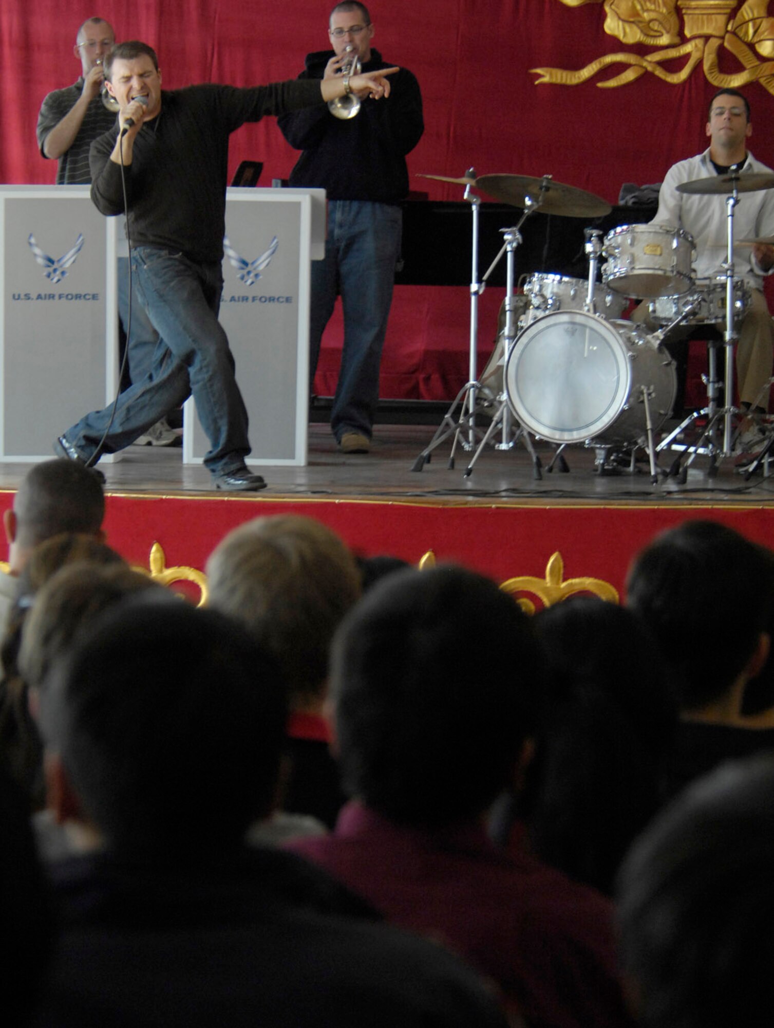 Staff Sgt. Jamie Gilley performs March 26 for students of the Bishkek College of Music in Kyrgyzstan. The Air Force band performed for Manas Air Base Airmen and local villages and schools during their six-day trip to Kyrgyzstan. Sergeant Gilley is a volocalist of the U.S. Air Forces Central Band Hot Brass. (U.S. Air Force photo/Senior Airman Tabitha Kuykendall) 
