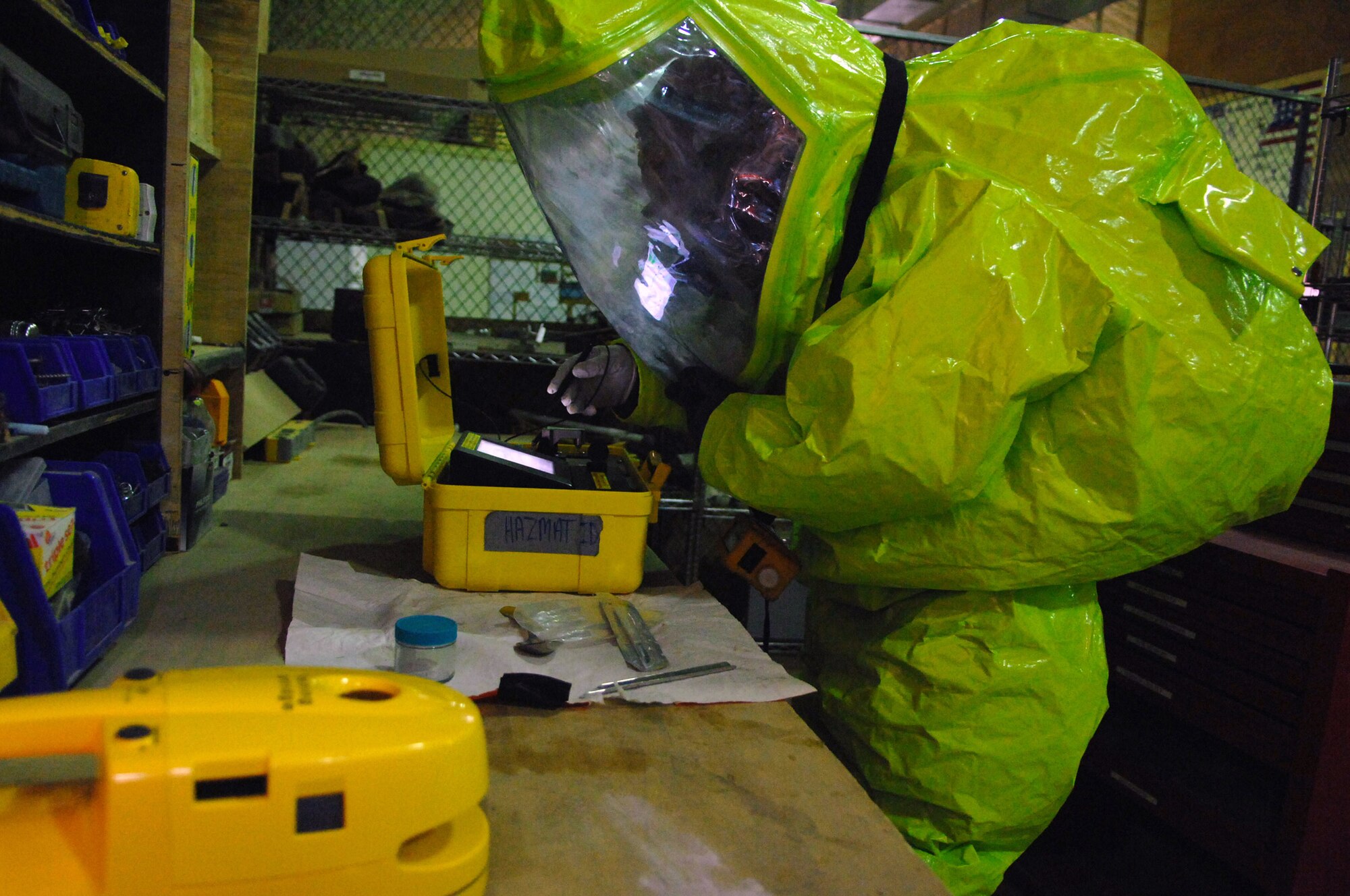 Senior Airman Michael Blair tests a sample of a mysterious substance during a battle drill held March 26 at Balad Air Base, Iraq. Emergency managers must keep their skills sharp by frequently conducting battle drills. Airman Blair is a 332nd Expeditionary Civil Engineer Squadron emergency manager and is deployed from McGuire Air Force Base, N.J. (U.S. Air Force photo/Senior Airman Julianne Showalter) 