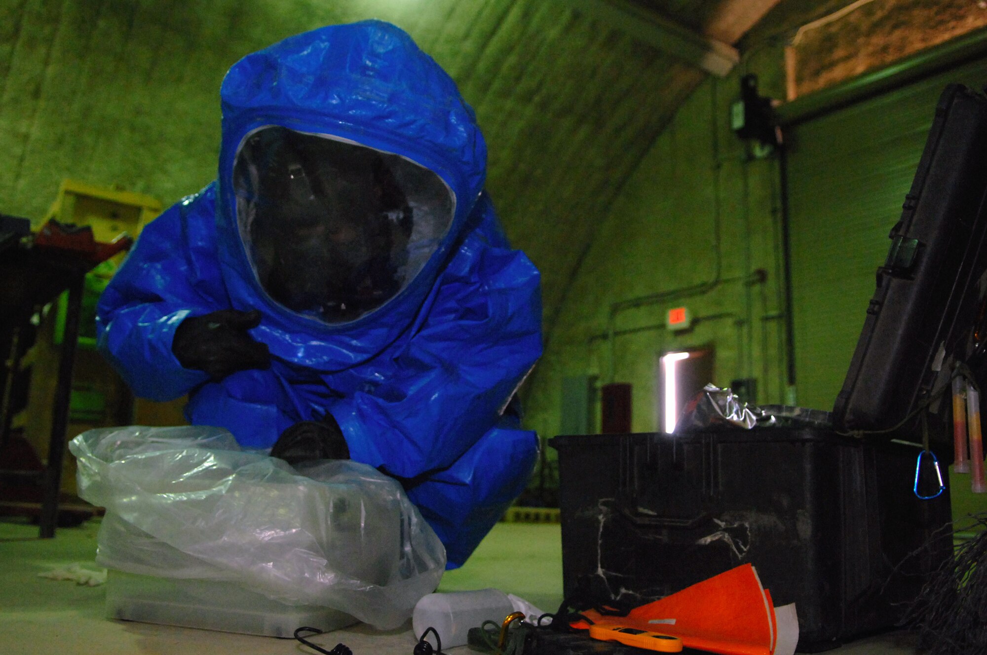 Senior Airman Krista McVicar bags a contamination collection box during a battle drill  March 26 at Balad Air Base, Iraq. Airman McVicar is a 332nd Expeditionary Civil Engineer Squadron emergency manager and is deployed from Davis-Monthan Air Force Base, Ariz. (U.S. Air Force photo/Senior Airman Julianne Showalter) 
