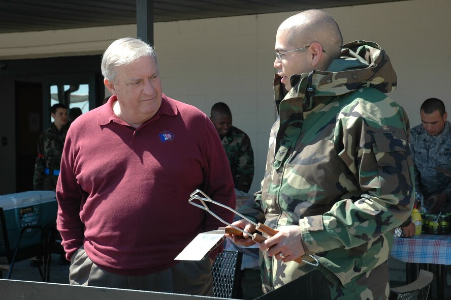 Former Chief Master Sgt. of the Air Force James C. Binnicker talks with Airman 1st Class Daniel Hernandez, 43rd Aircraft Maintenance Unit F-22 intergrated avionics systems apprentice, during the Air Force Assistance Fund Kick-off March 24. Chief Binnicker is the president of the Air Force Enlisted Village, one of the AFAF affiliates. 
[U.S. Air Force photo/Staff Sgt. Timothy Capling]